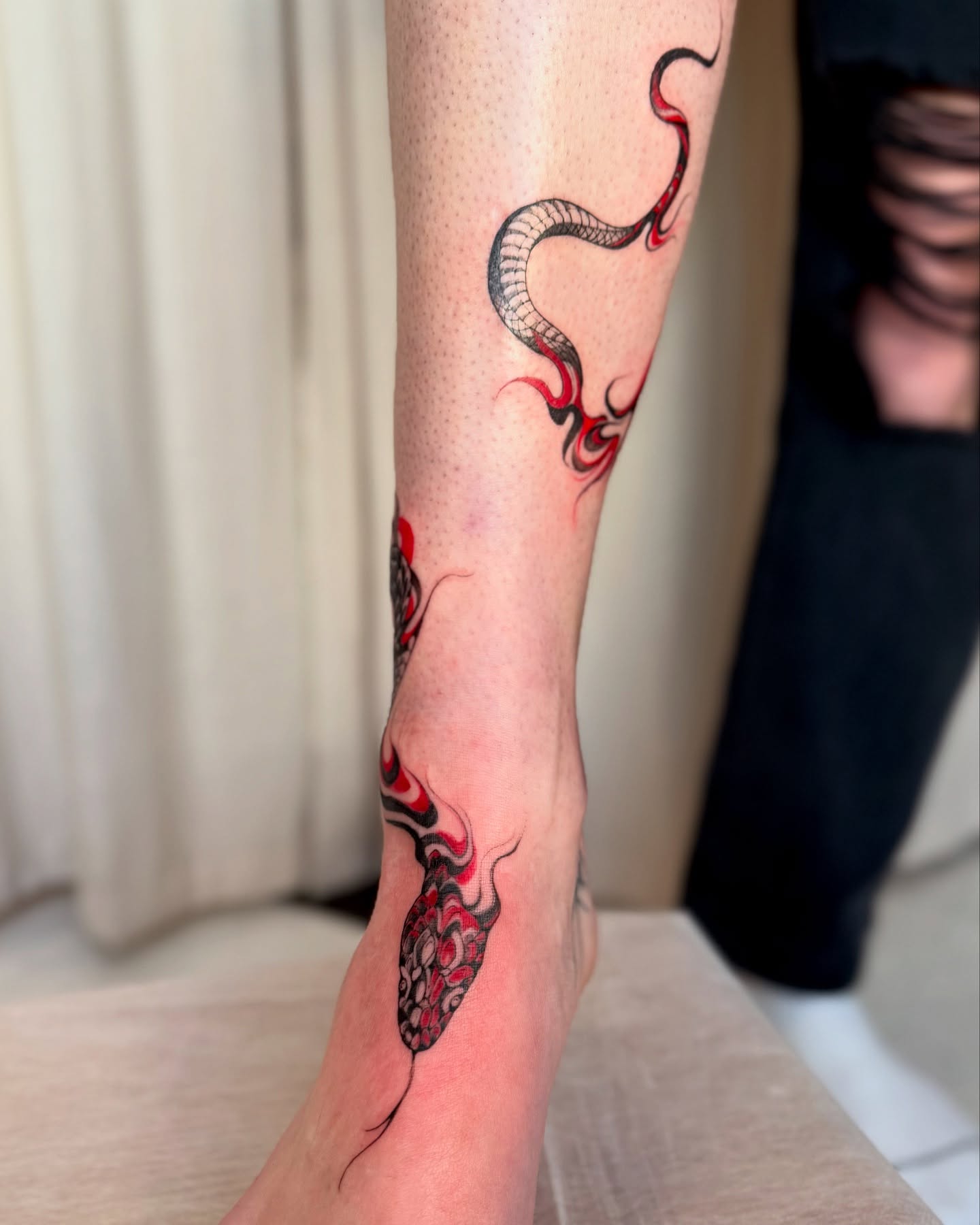 Snake dotwork tattoo on the calf by Dung Ngo