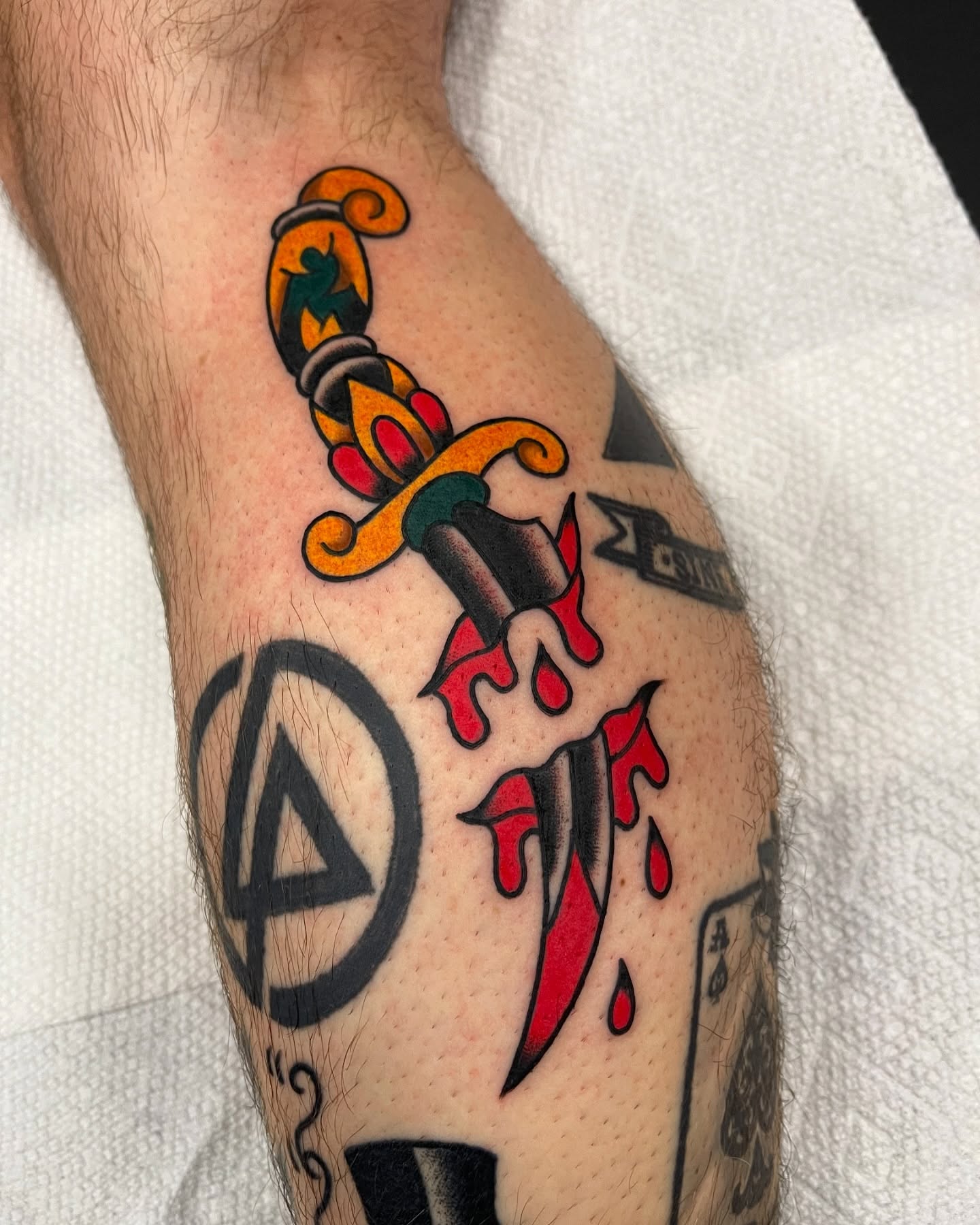 Knife with blood American traditional tattoo on the forearm by Alva - DFW Tattoo Artist