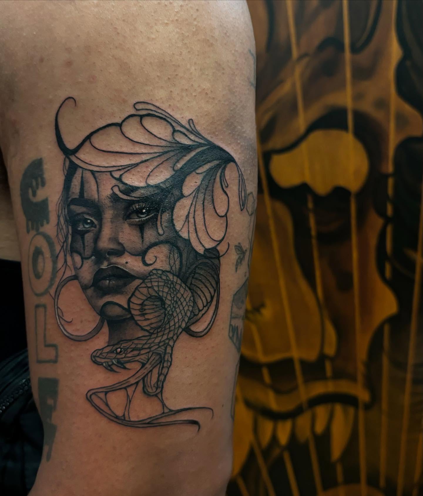 Woman with snake realism tattoo on the forearm by orlando
