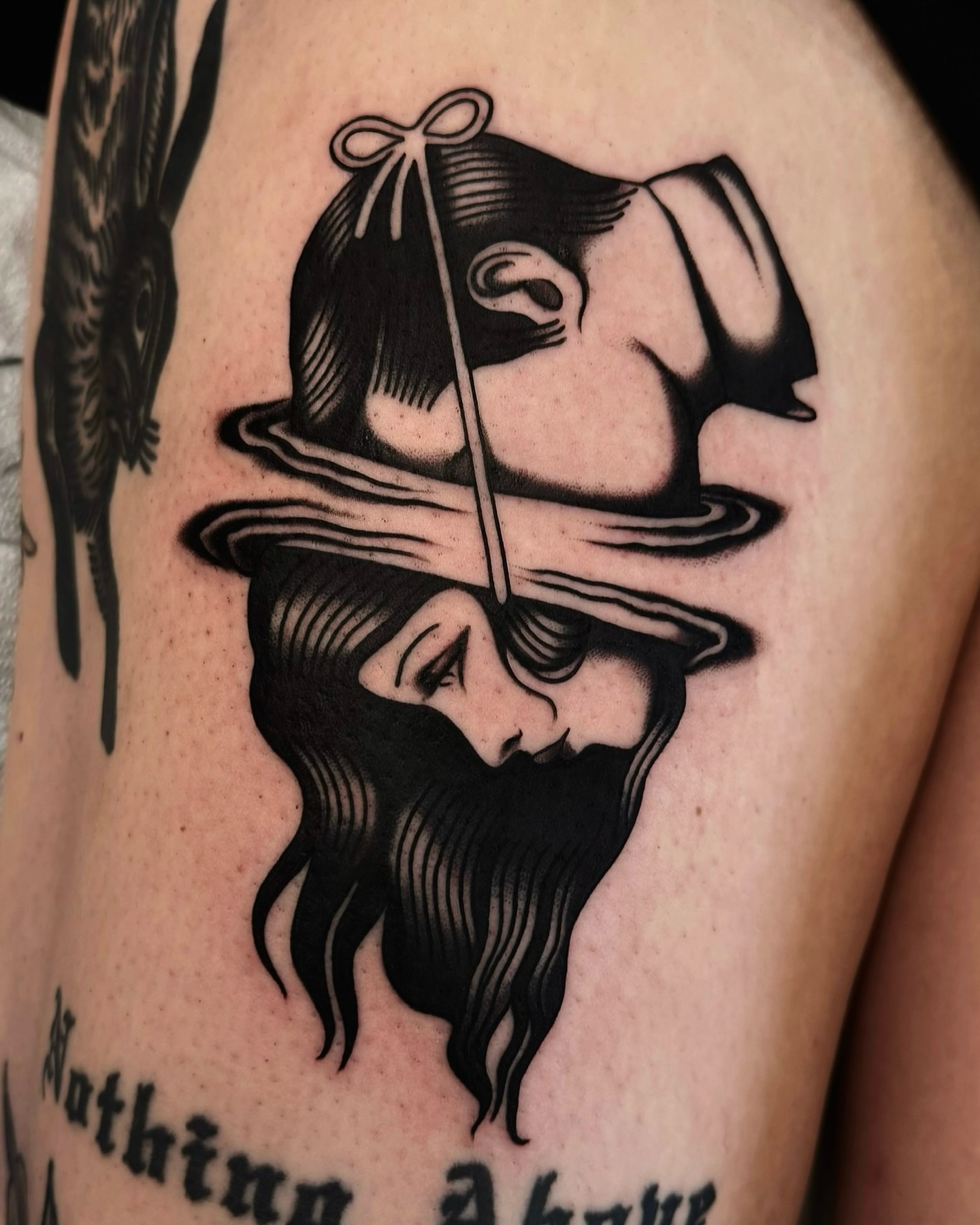 Man with hat black and grey tattoo on the upper arm by 𝒟𝑜𝓃𝓃𝒶 𝒥 ࿏ Portland Tattoo Artist