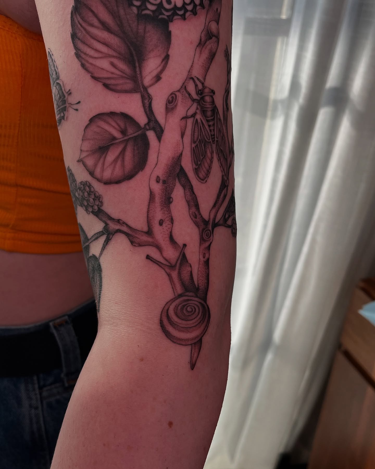 Tree with insects and snail dotwork tattoo on the forearm by Kyla Jae