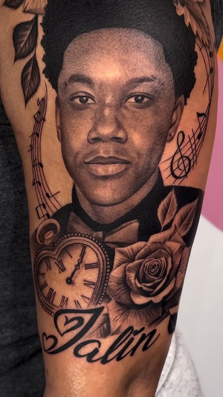 Young man portrait and roses realism tattoo by Imarea Rivera