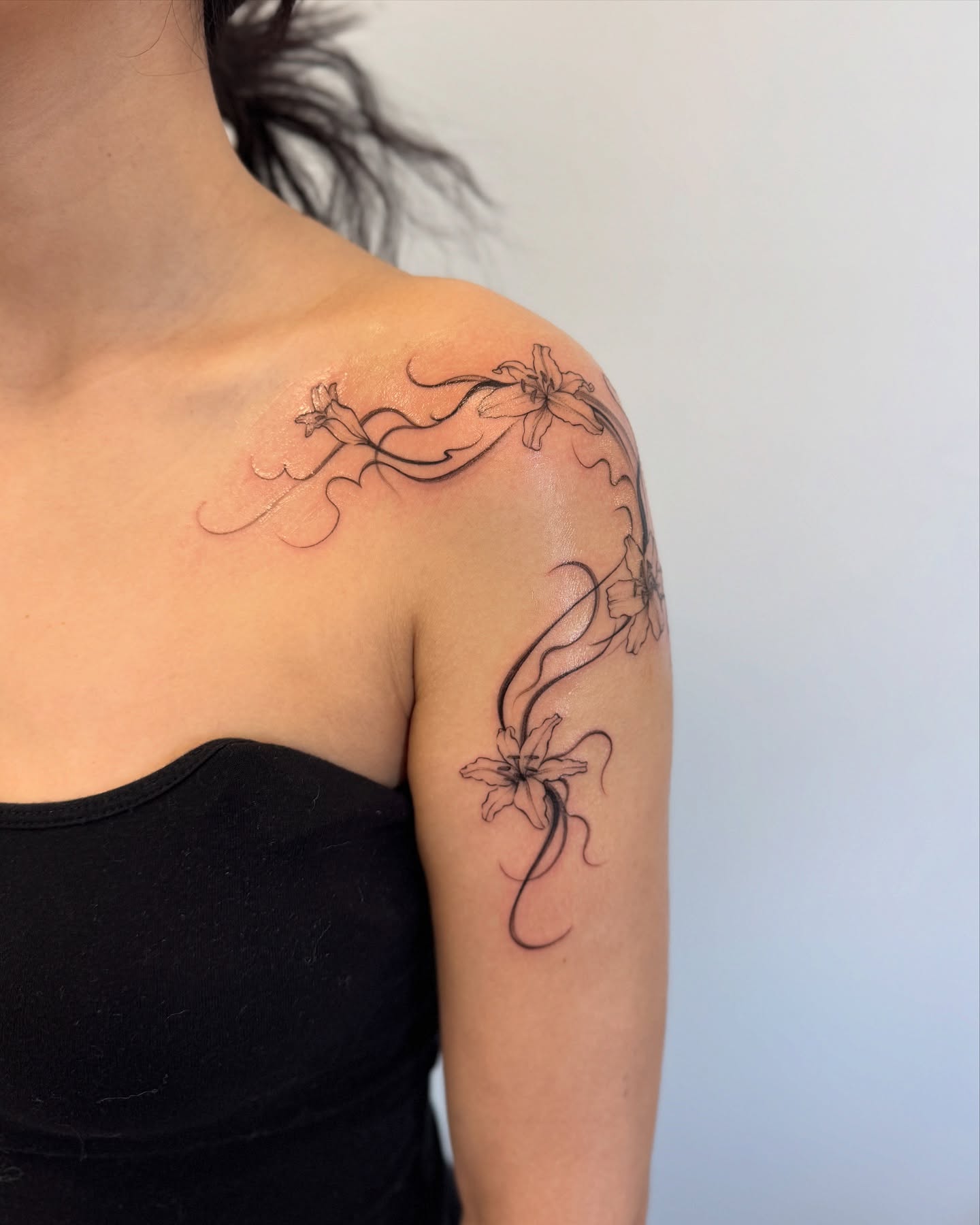 Floral design black and grey tattoo on the shoulder by Jasmine, Lynnwood, Washington