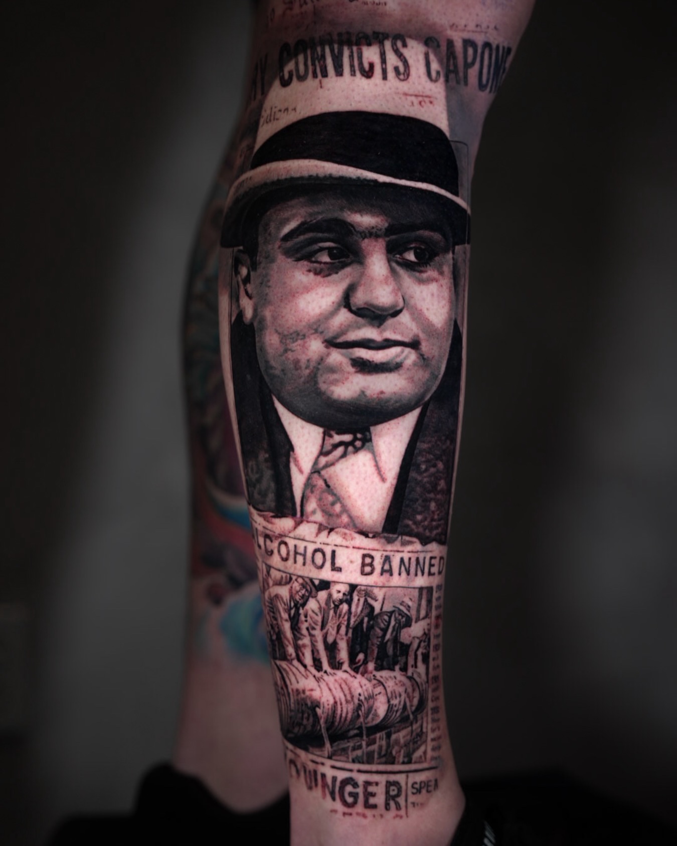 Gangster portrait realism tattoo on the forearm by Bailey Lemus