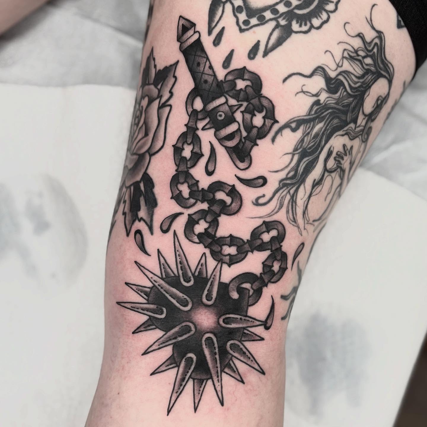 Spiked ball American traditional tattoo on the forearm by Cody Collins