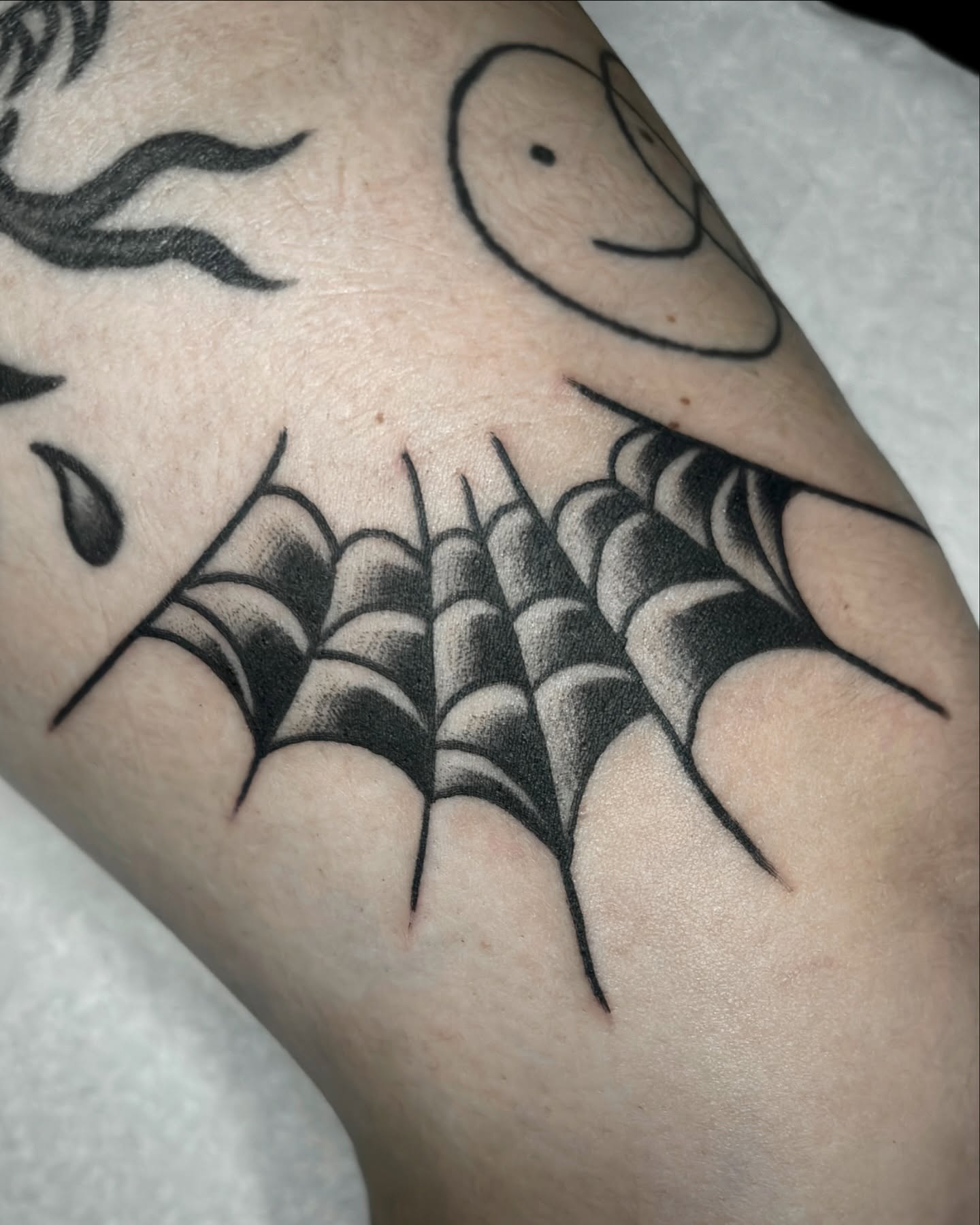 Spiderweb black and grey tattoo on the forearm by Matt Elliott, Murfreesboro, Tennessee