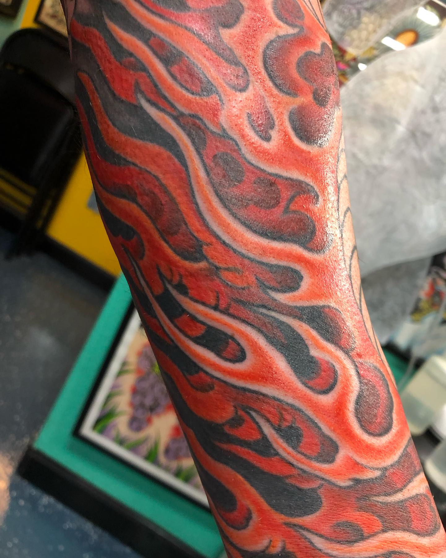 Flame design neo-traditional tattoo on the forearm by Matt Klass