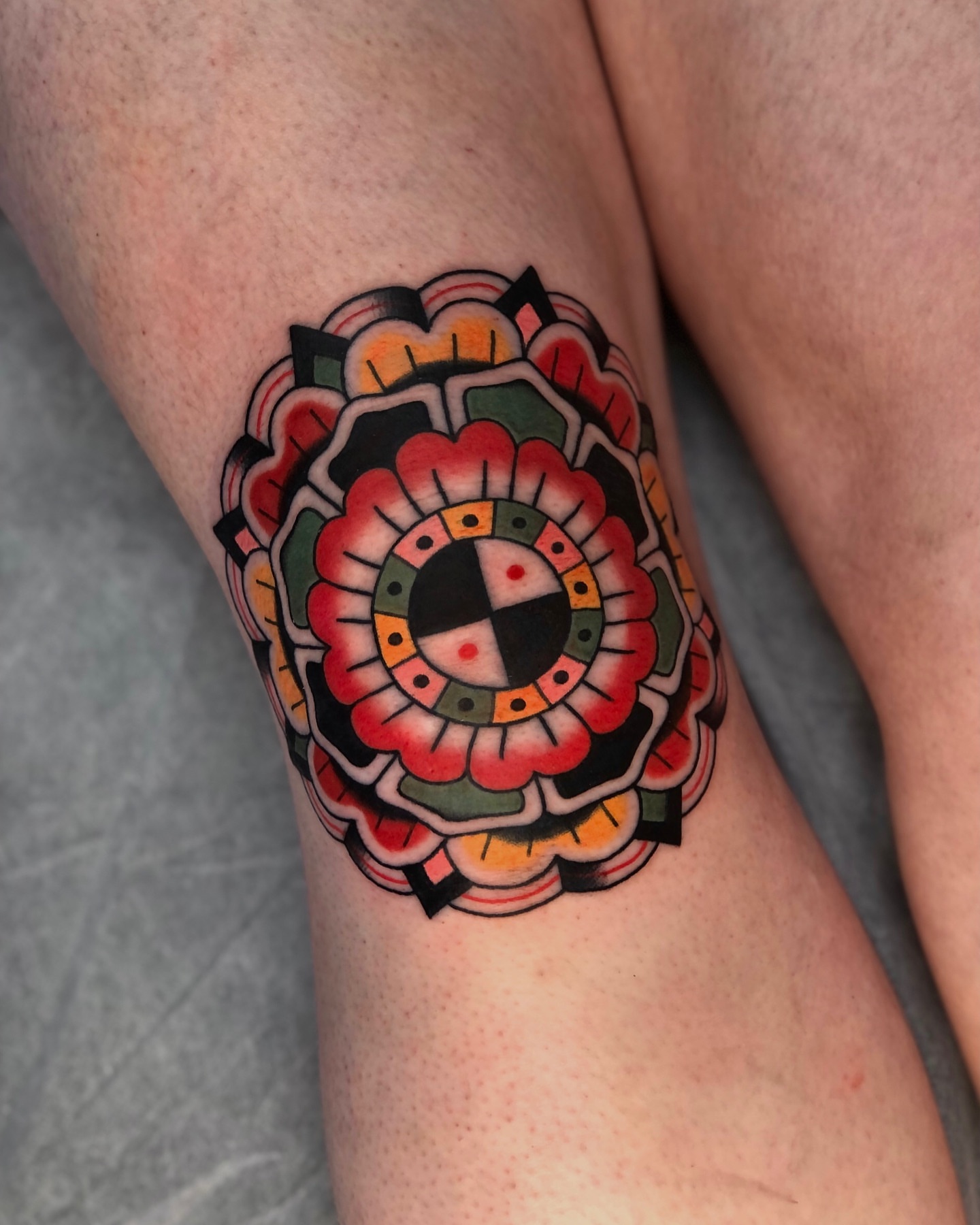 Geometric flower geometric tattoo on the thigh by EVA Traditional Tattoos
