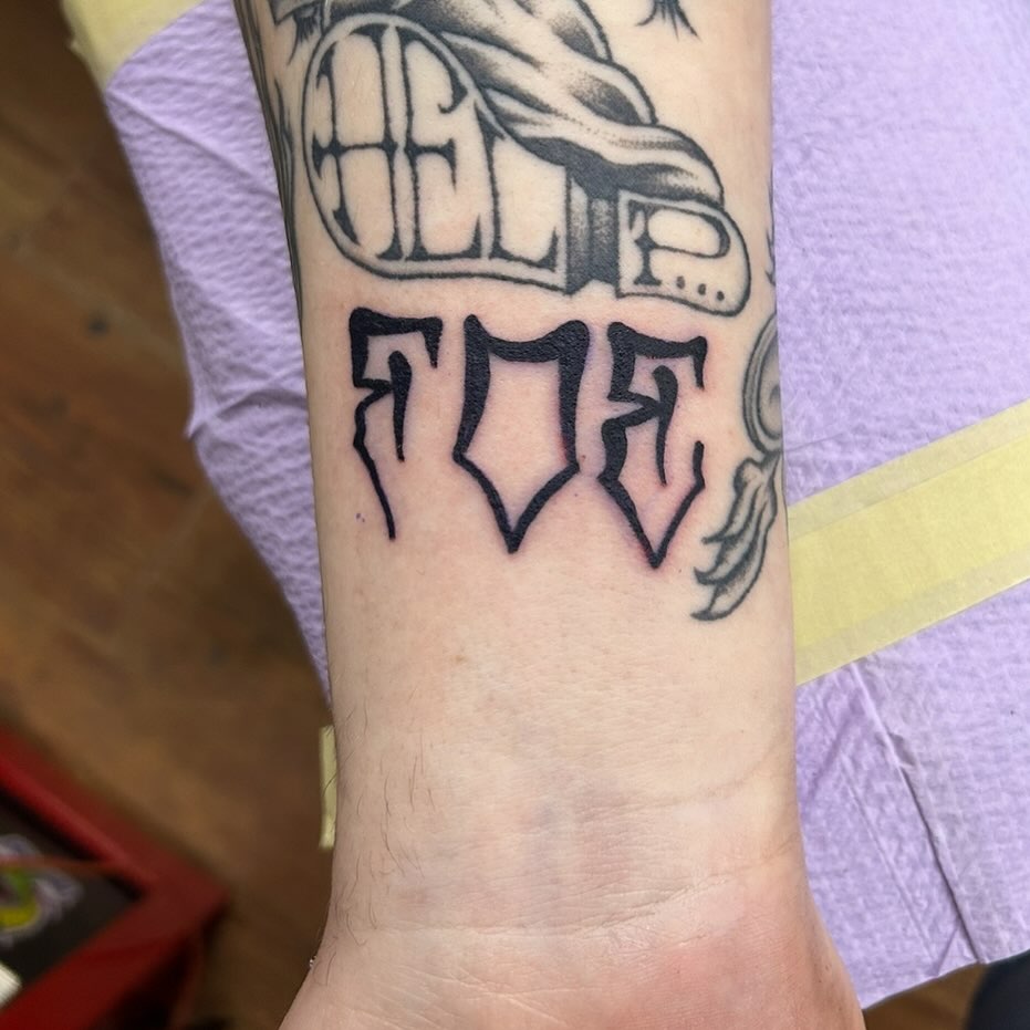 Hel toe black and grey tattoo on the forearm by Elizabeth Niederkorn
