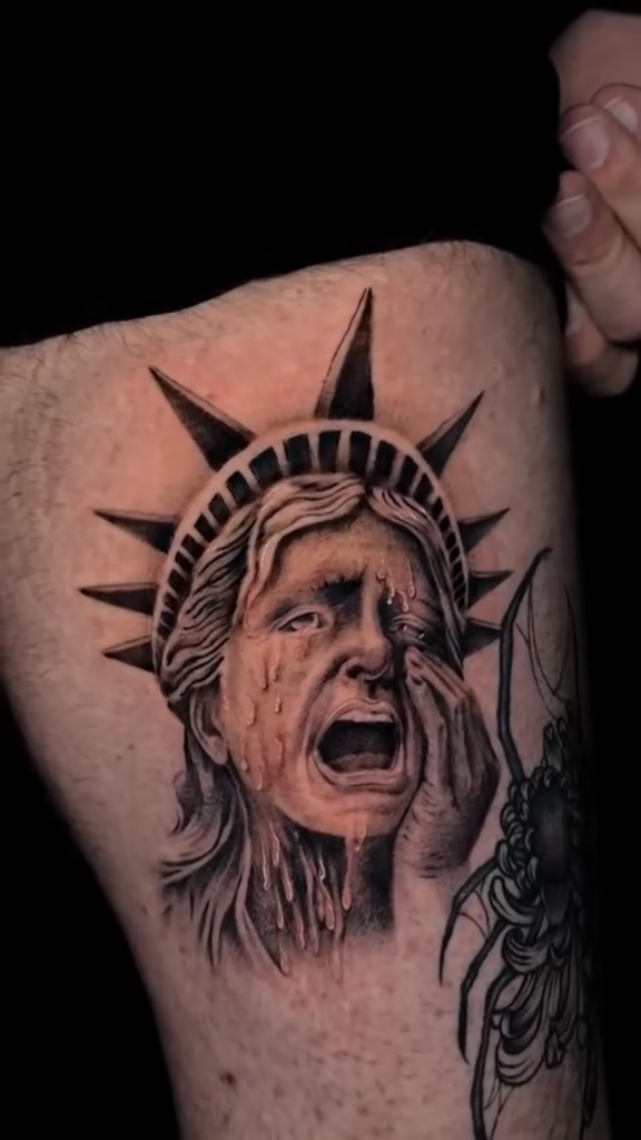 Statue of Liberty crying realism tattoo by Dani B.