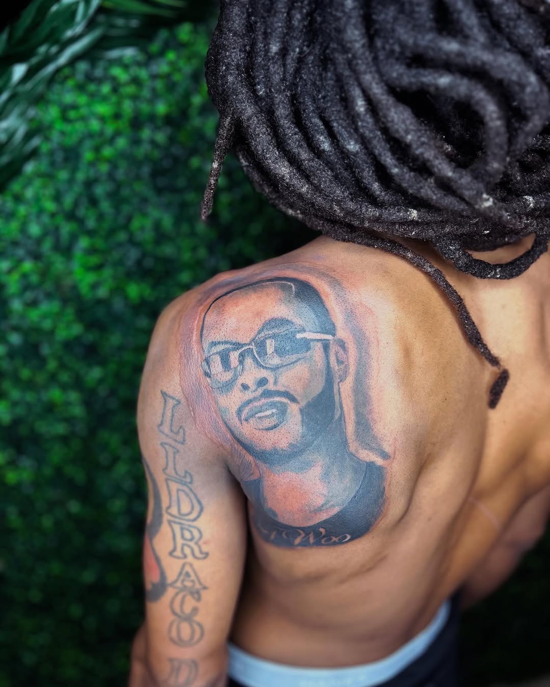 Portrait of a man with glasses realism tattoo on the shoulder by Uncle Fade Tattoo Artist ✍🏾