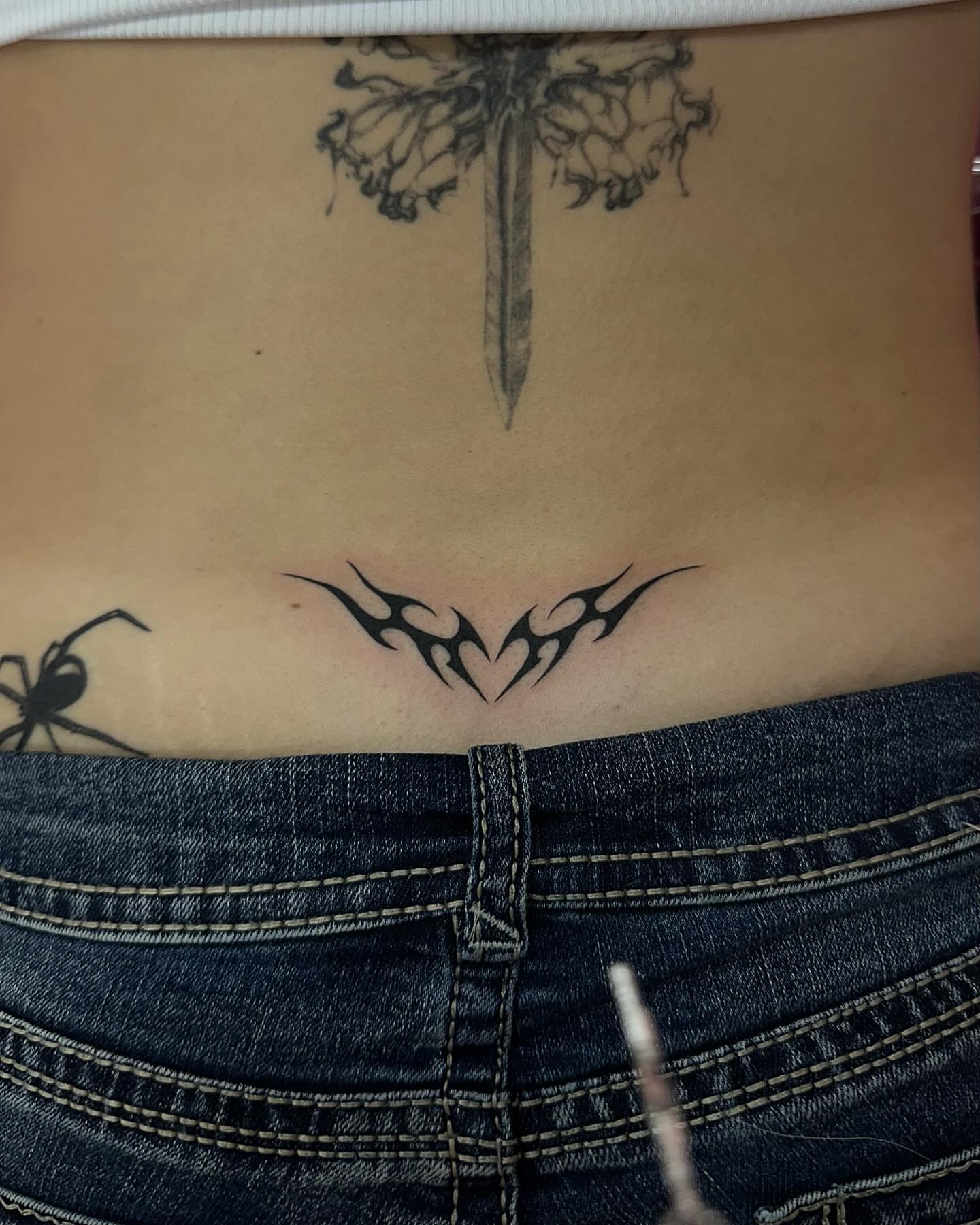 Tribal design tribal tattoo on the torso by Emily‹𝟹