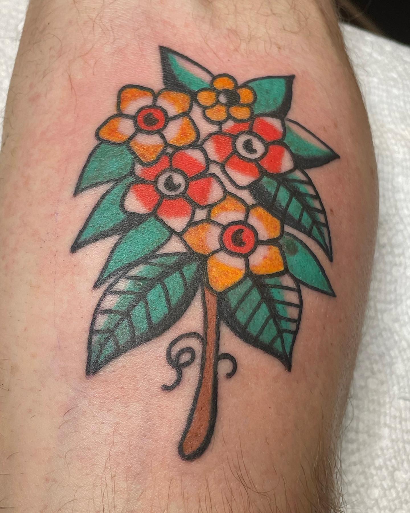 Floral bouquet American traditional tattoo on the thigh by nancy❣️