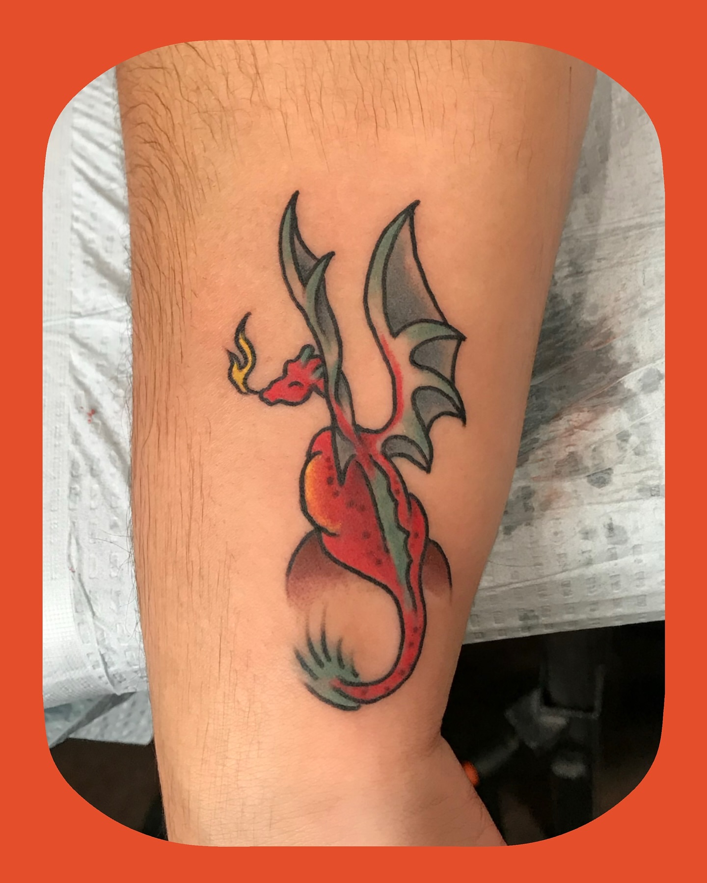 Dragon American traditional tattoo on the forearm by Chris Chapman