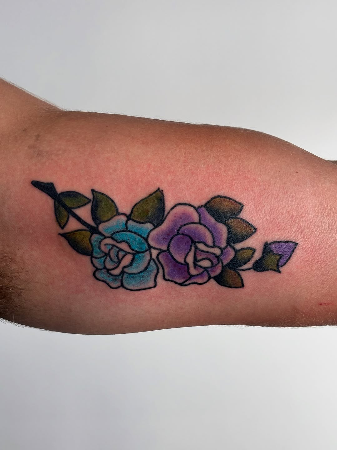 Two roses on a branch neo-traditional tattoo on the forearm by ♱ C ♱, Dallas, Texas