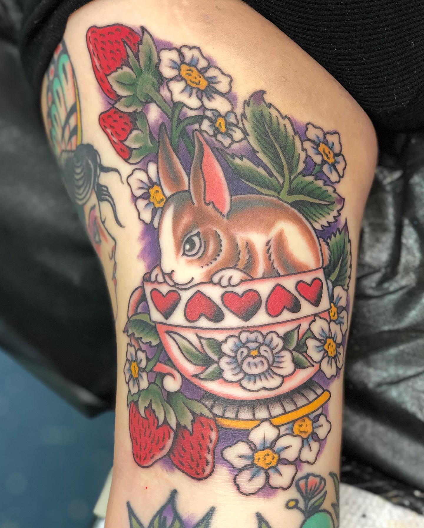 Rabbit in teacup American traditional tattoo on the thigh by Matt Klass