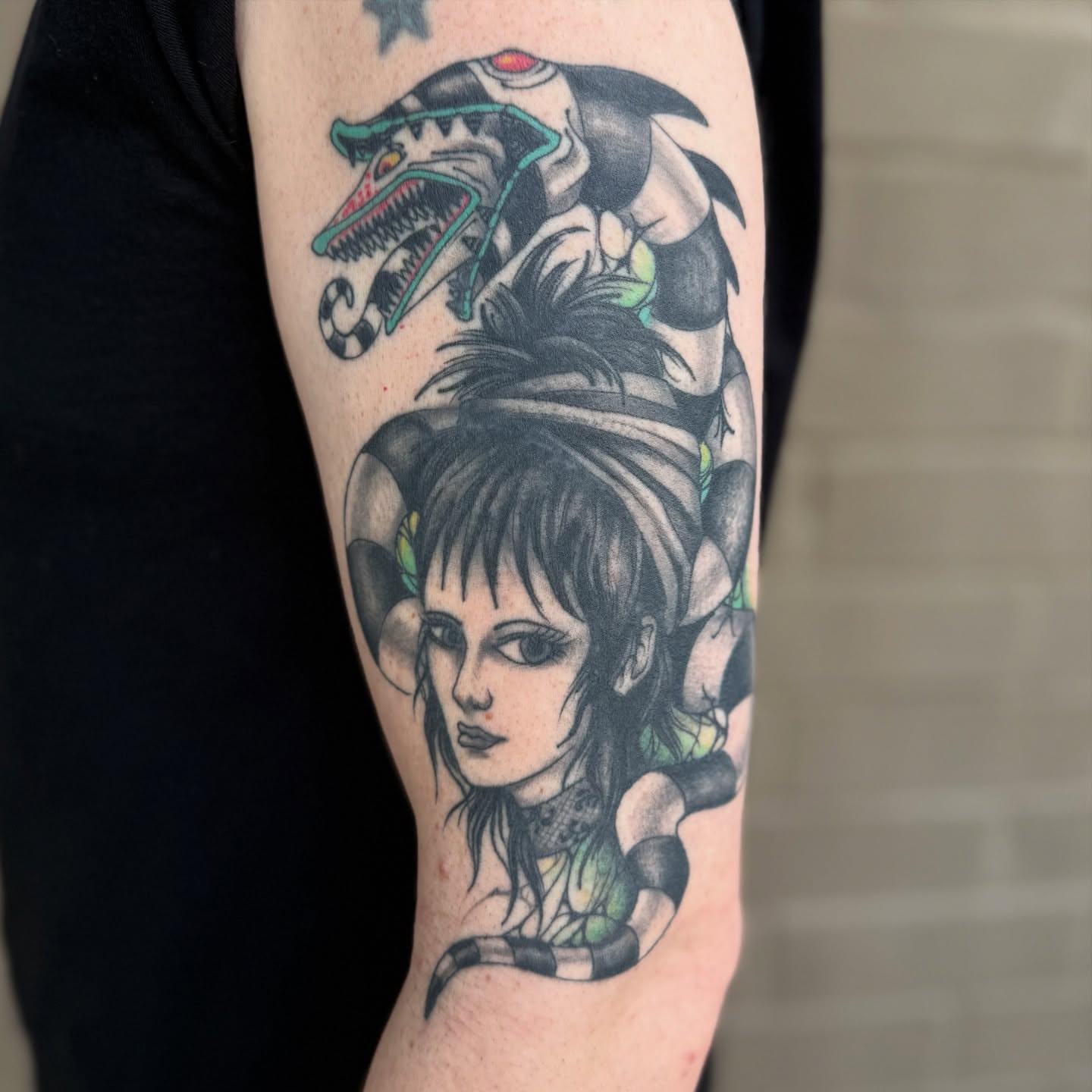 Woman with dragon American traditional tattoo on the forearm by Scott Kulikowski