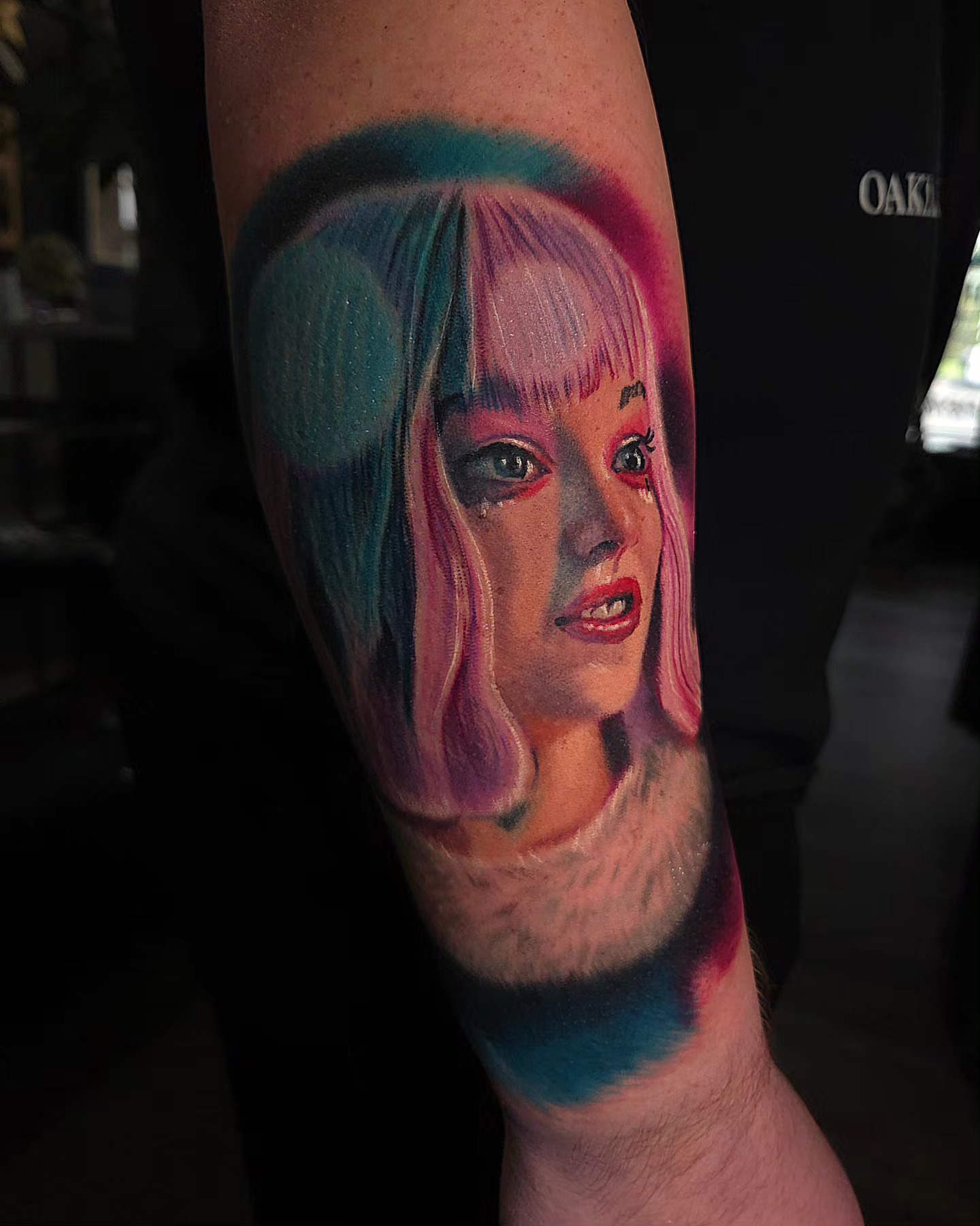 Woman with colorful wig realism tattoo on the forearm by Color Realism Tattoos - Metro Detroit