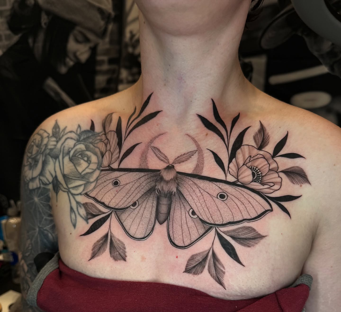 Moth and floral arrangement realism tattoo on the chest by πππππ βππ£π£ππ€ππ , Tucson, Arizona