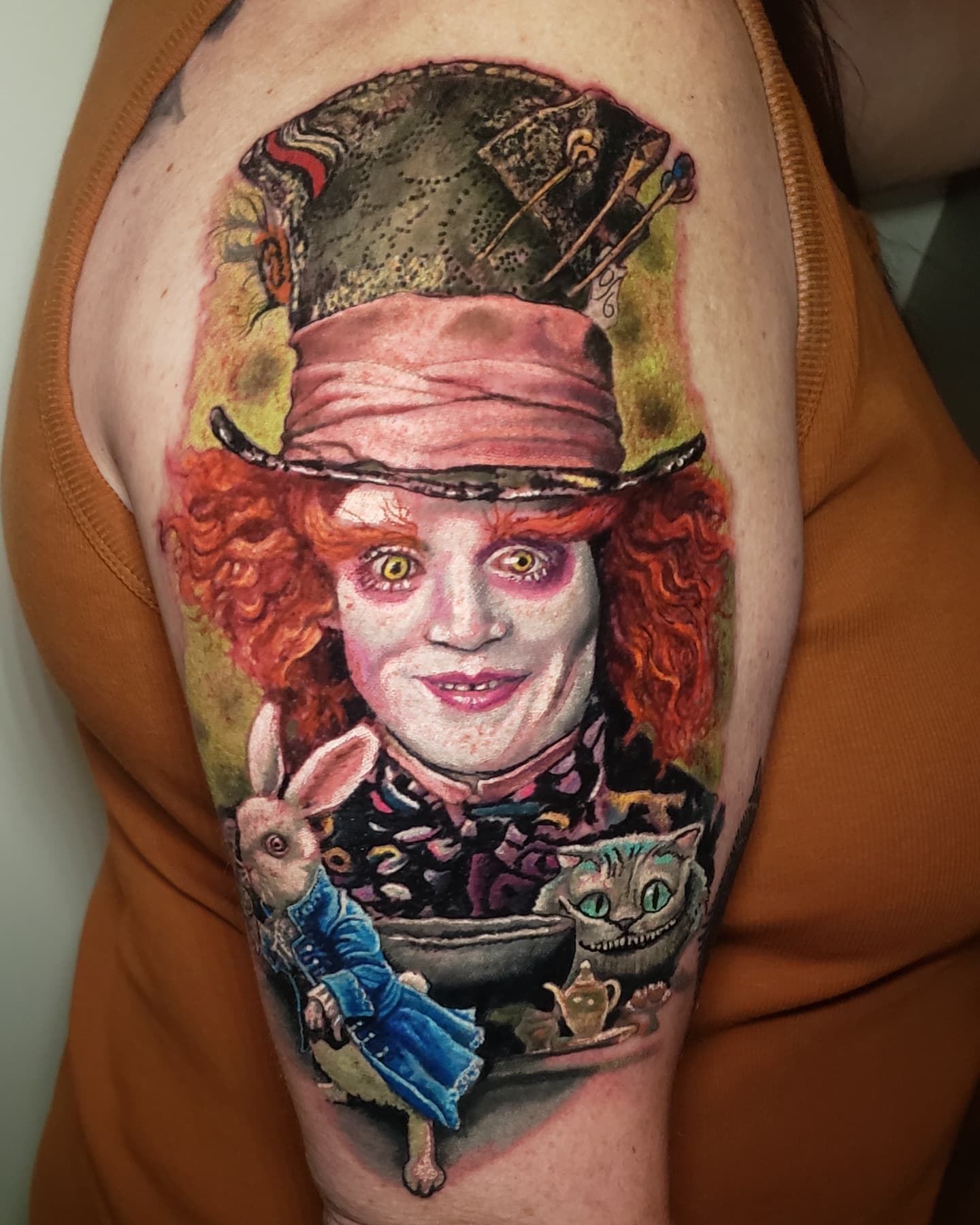 Mad hatter realism tattoo on the shoulder by Bruce Riehl