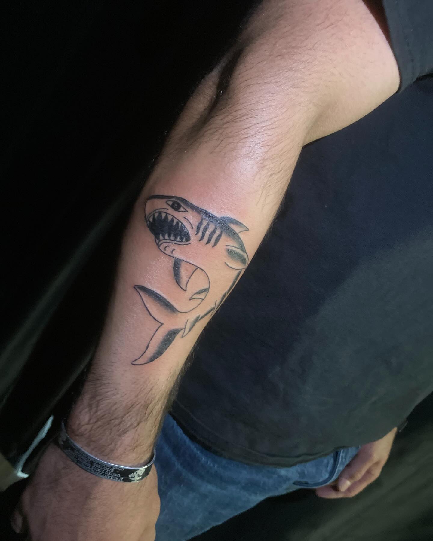 Shark black and grey tattoo on the forearm by Adrián Banuelos