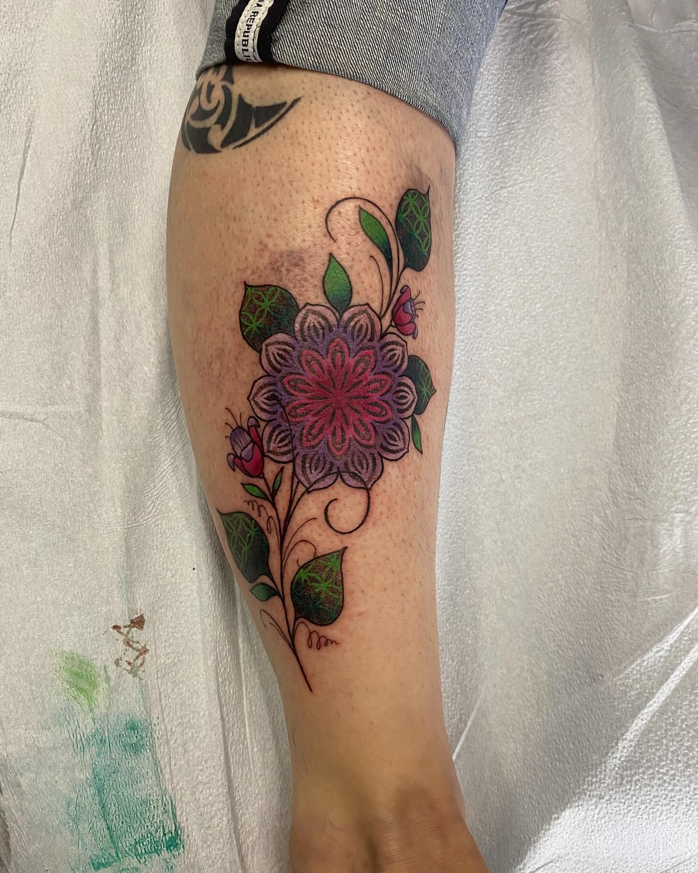 Floral arrangement new school tattoo on the forearm by Nicholas Jones