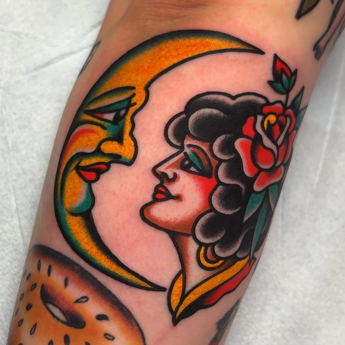 Moon and woman American traditional tattoo on the forearm by John Lemon