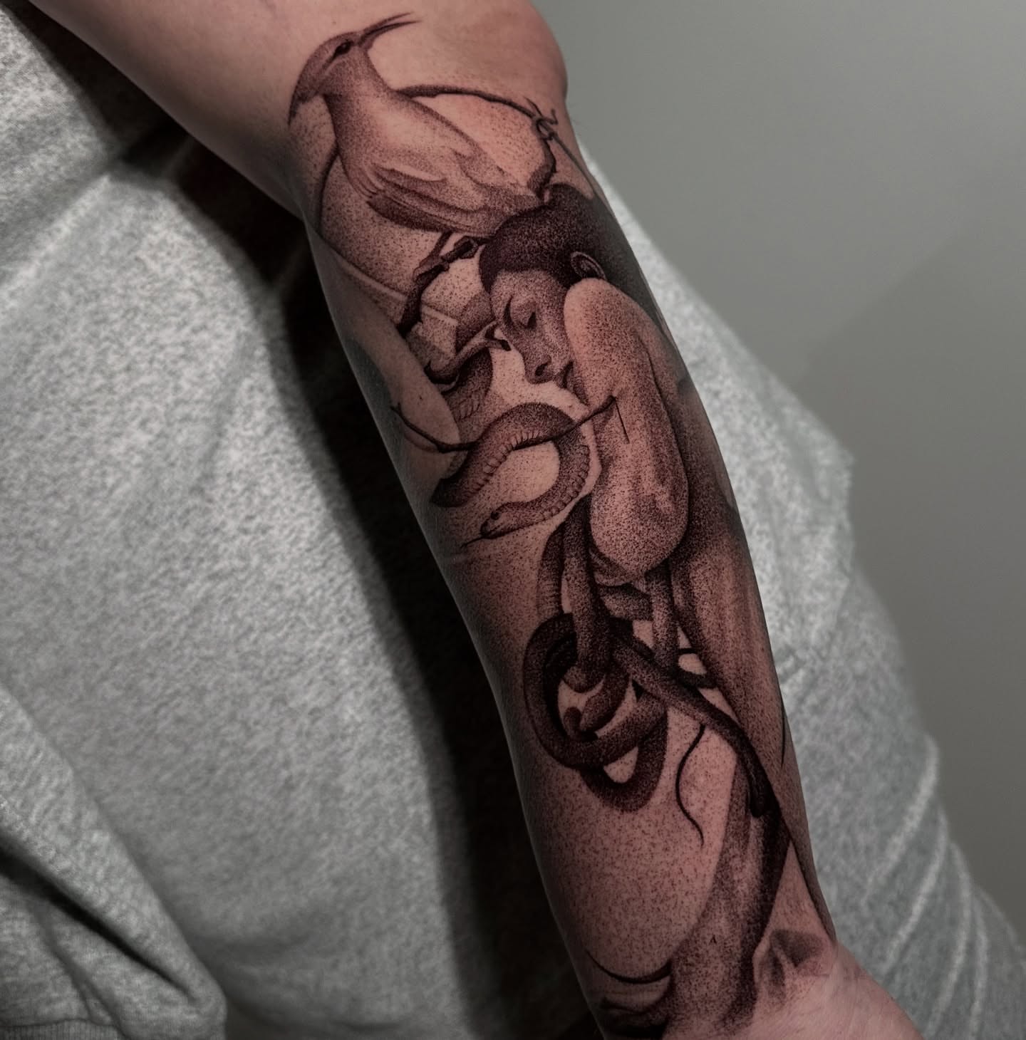 Snake and woman dotwork tattoo on the forearm by ᴰᴿᴬᴳᴼᴺ