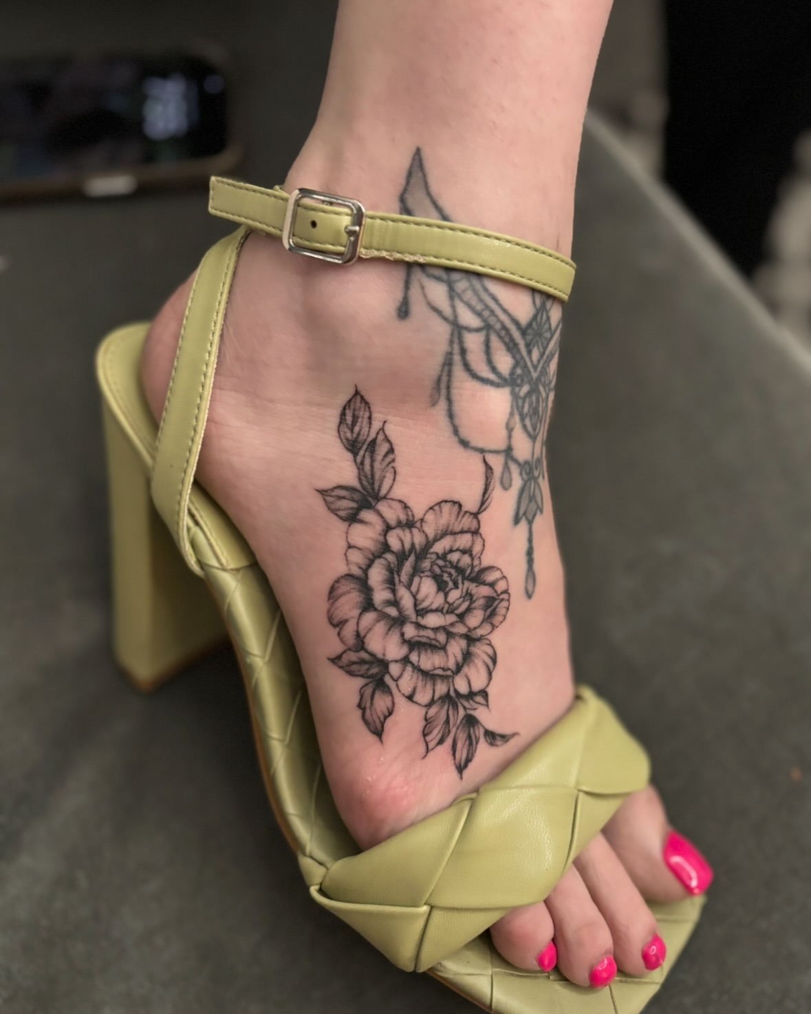 Flower black and grey tattoo on the foot by $weet little leslie 🩶🧚🏻‍♀️