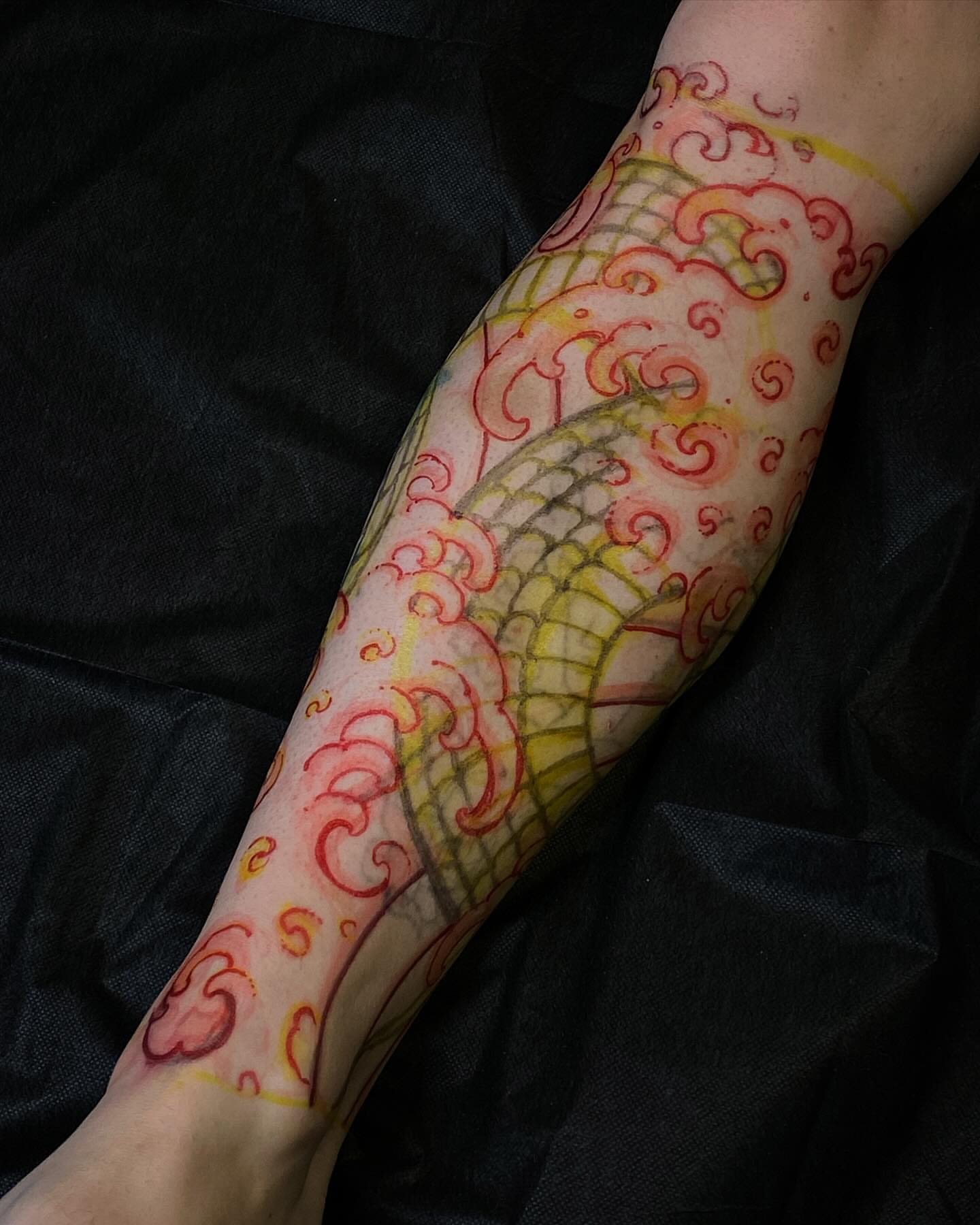 Mermaid tail watercolor tattoo on the forearm by Tyler Charles
