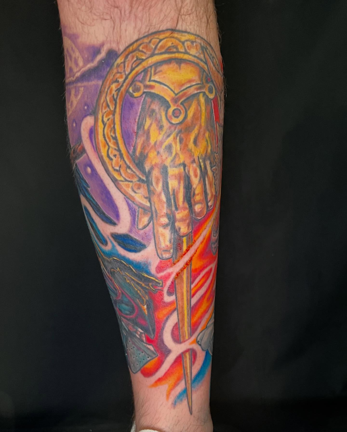 Hand with sword dotwork tattoo on the forearm by Patrick Cornolo