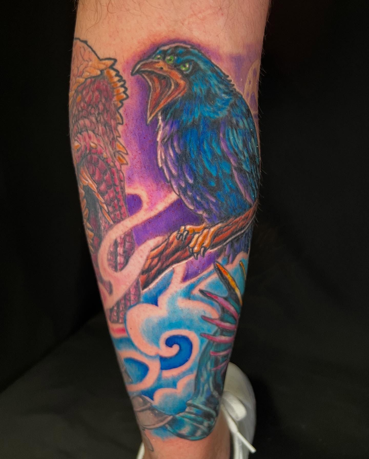 Crow realism tattoo on the forearm by Patrick Cornolo