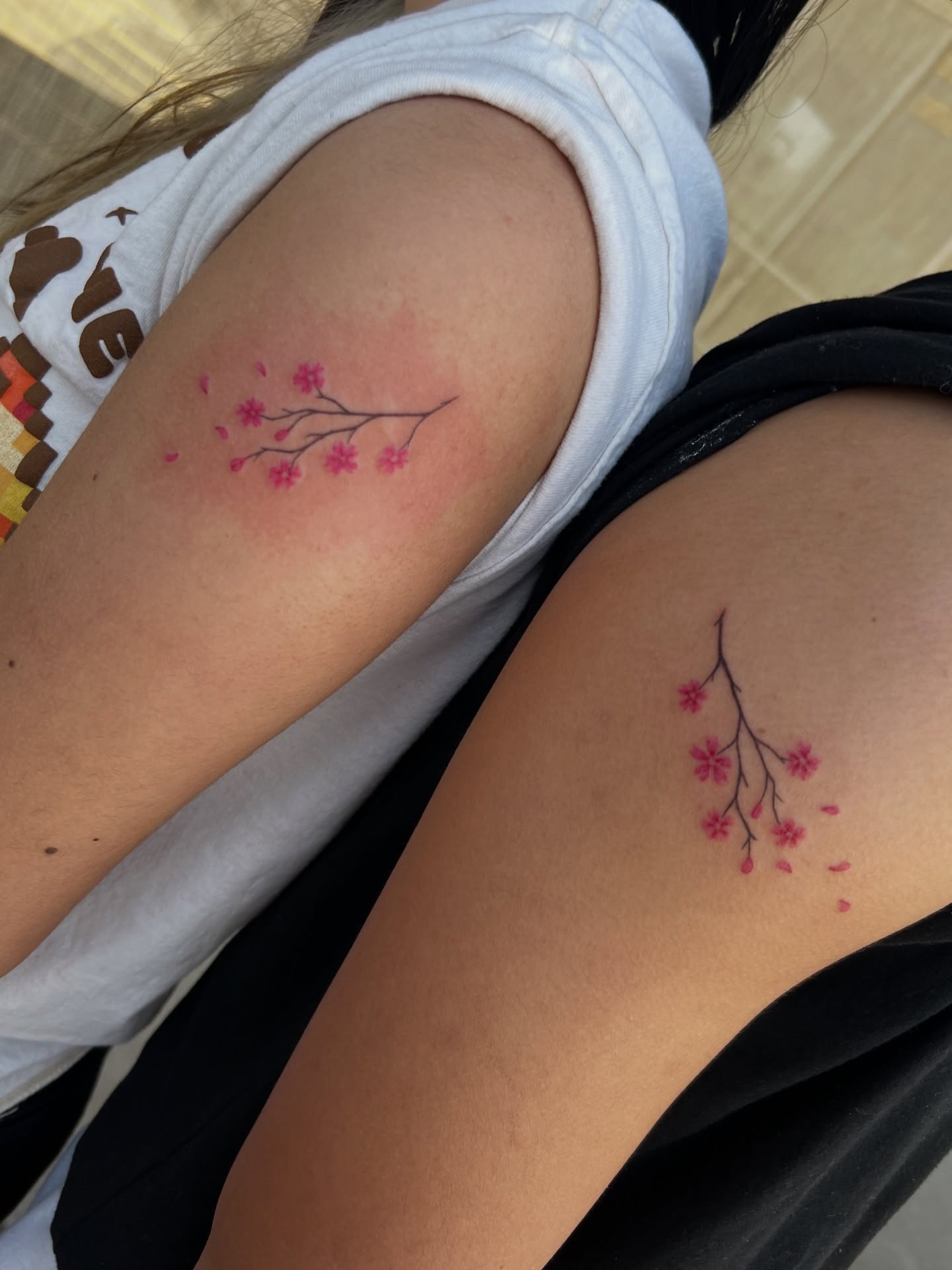 Cherry blossom branch dotwork tattoo on the upper arm by tatman cris 🥀 dfw tattoo artist