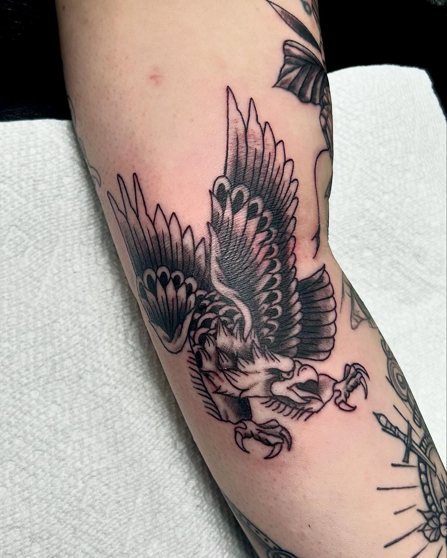 Eagle black and grey tattoo on the forearm by Brittany Brutal