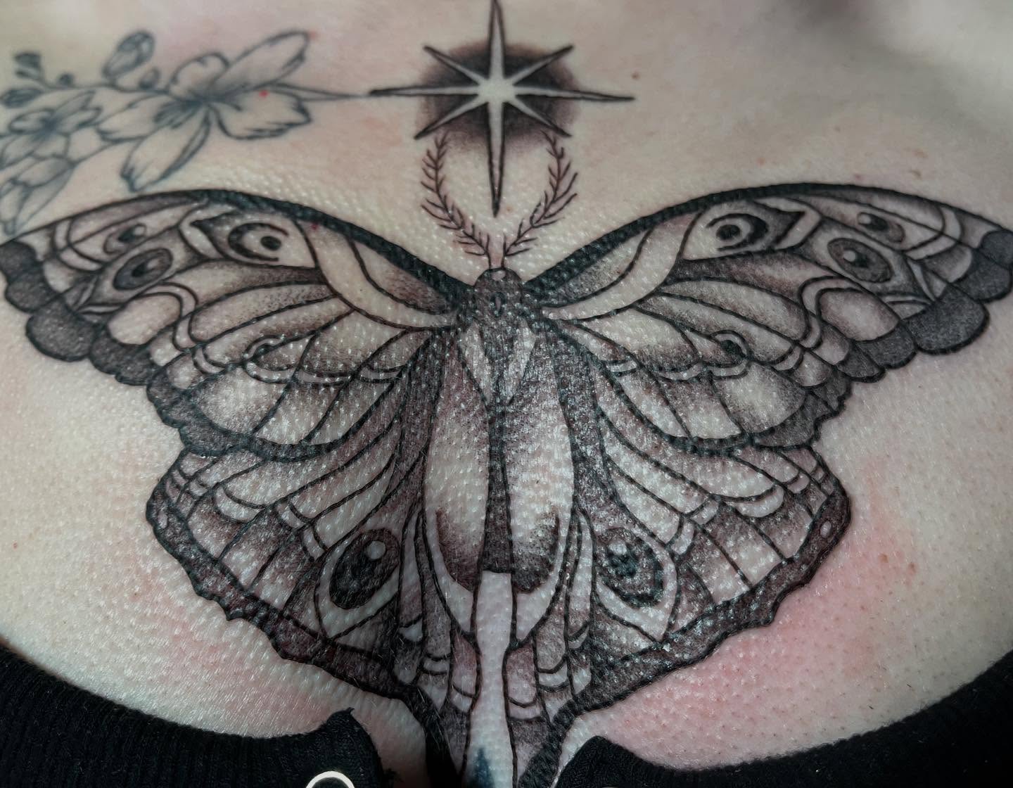 Butterfly black and grey tattoo on the torso by San Diego tattoo artist
