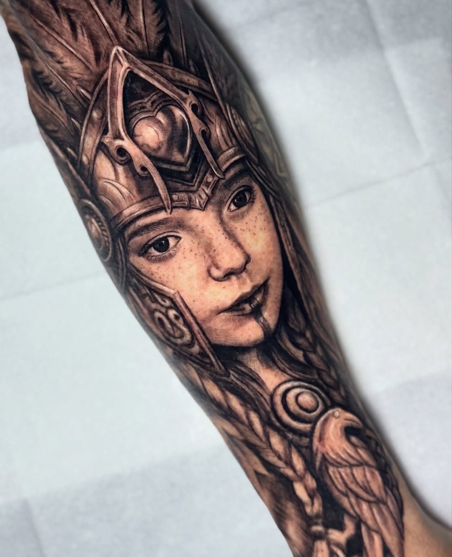Woman with helmet realism tattoo on the forearm by Morgan Andres Soto