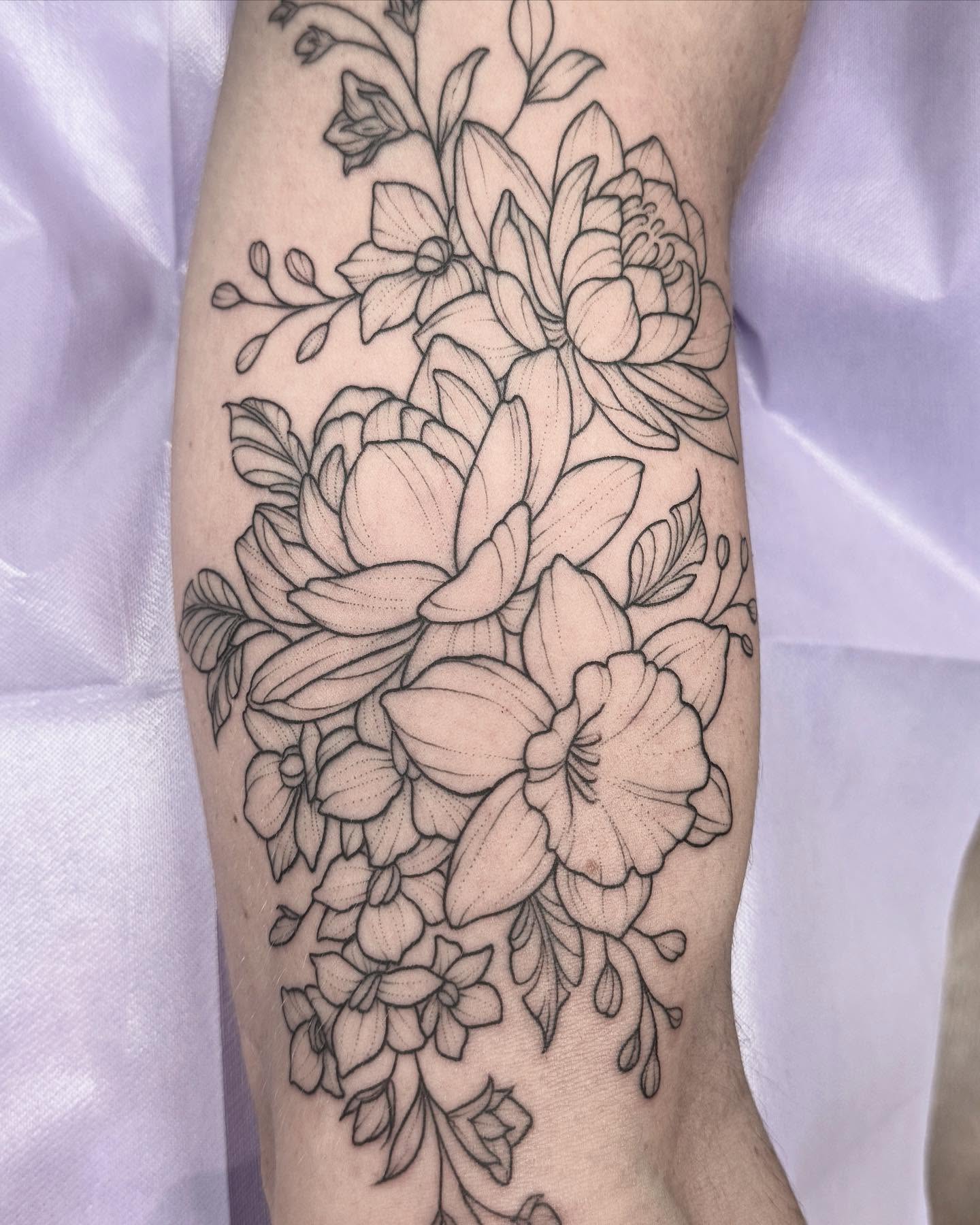 Floral bouquet black and grey tattoo on the forearm by Kirsten Marsden Ballantyne