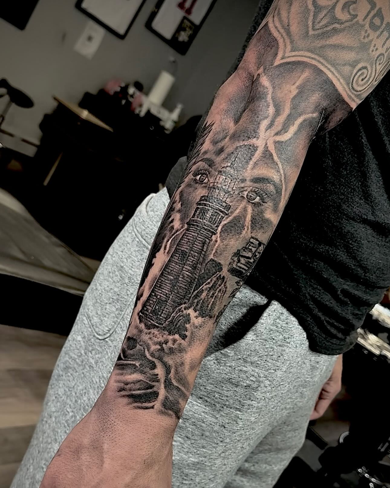 Cityscape realism tattoo on the forearm by Tatt2T (T King)
