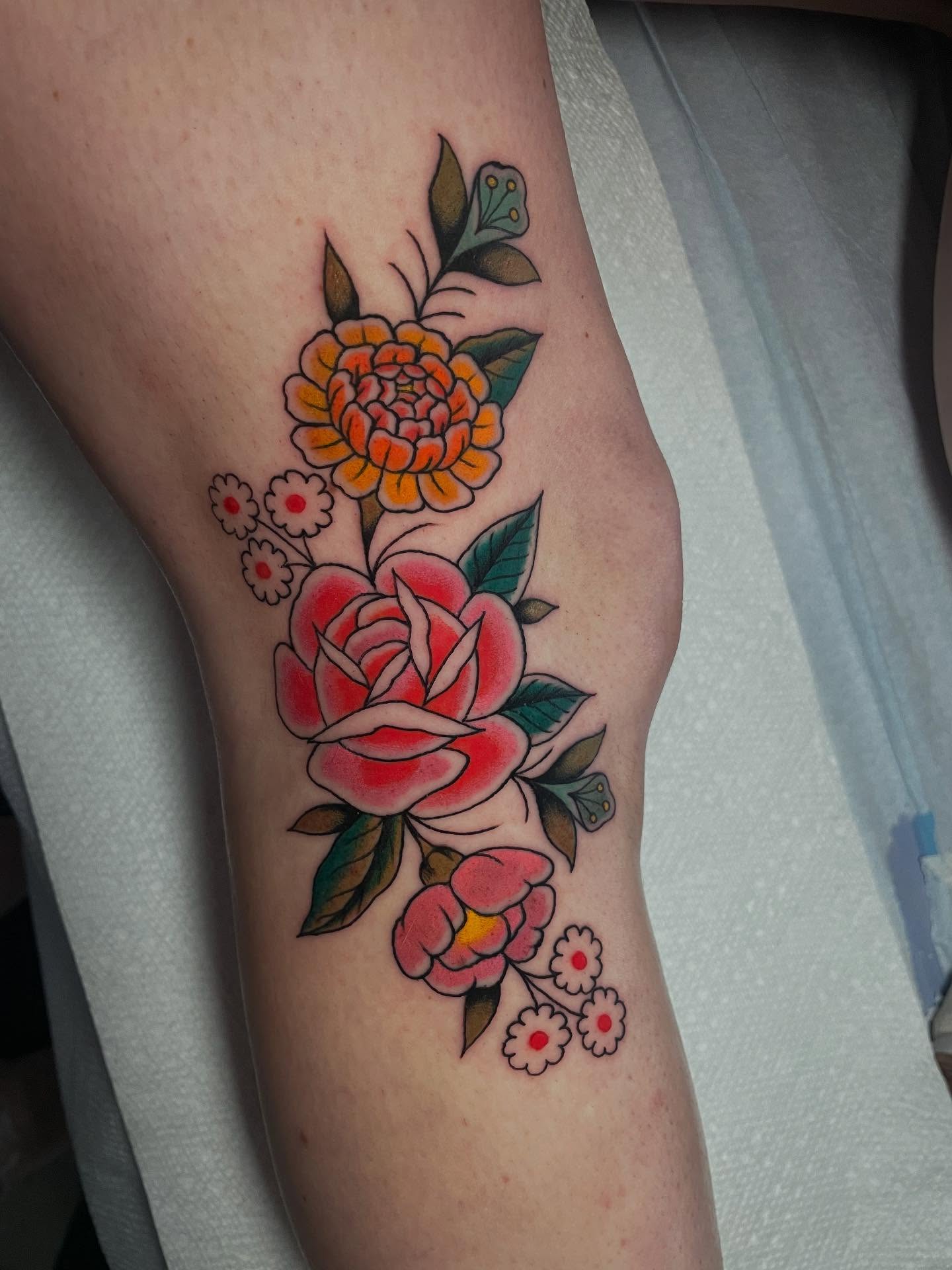 Floral arrangement American traditional tattoo on the forearm by Dayton Tattoo Artist, Miamisburg, Ohio