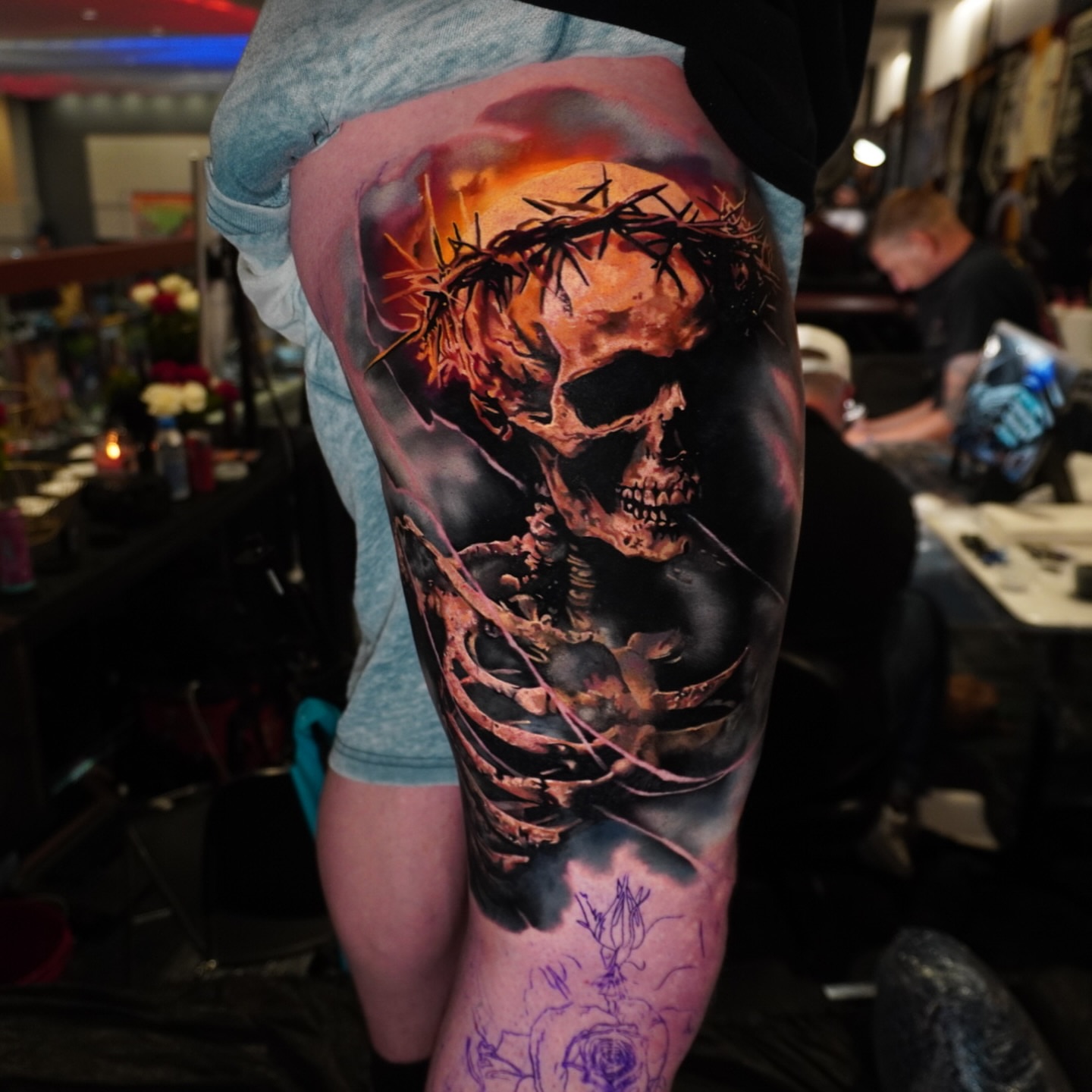 Skull with crown of thorns dark realism tattoo on the thigh by Justin Shelpman