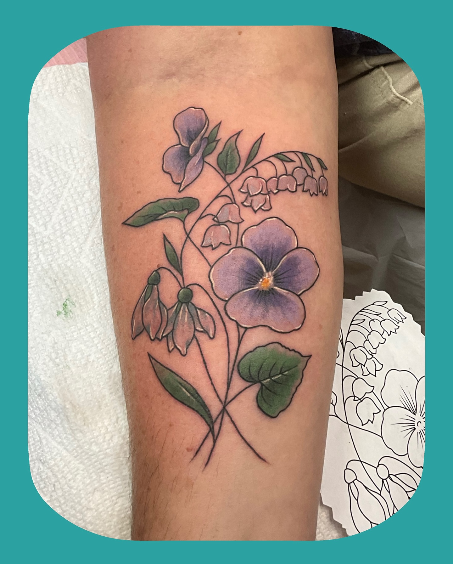 Violet and bellflower realism tattoo on the forearm by Chris Chapman