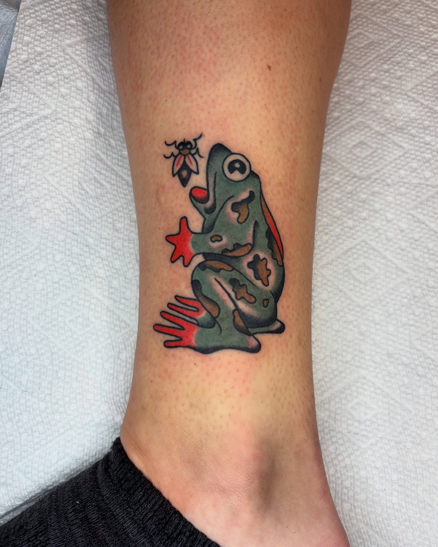 Frog American traditional tattoo on the forearm by Charlie Dunkel Tattoo