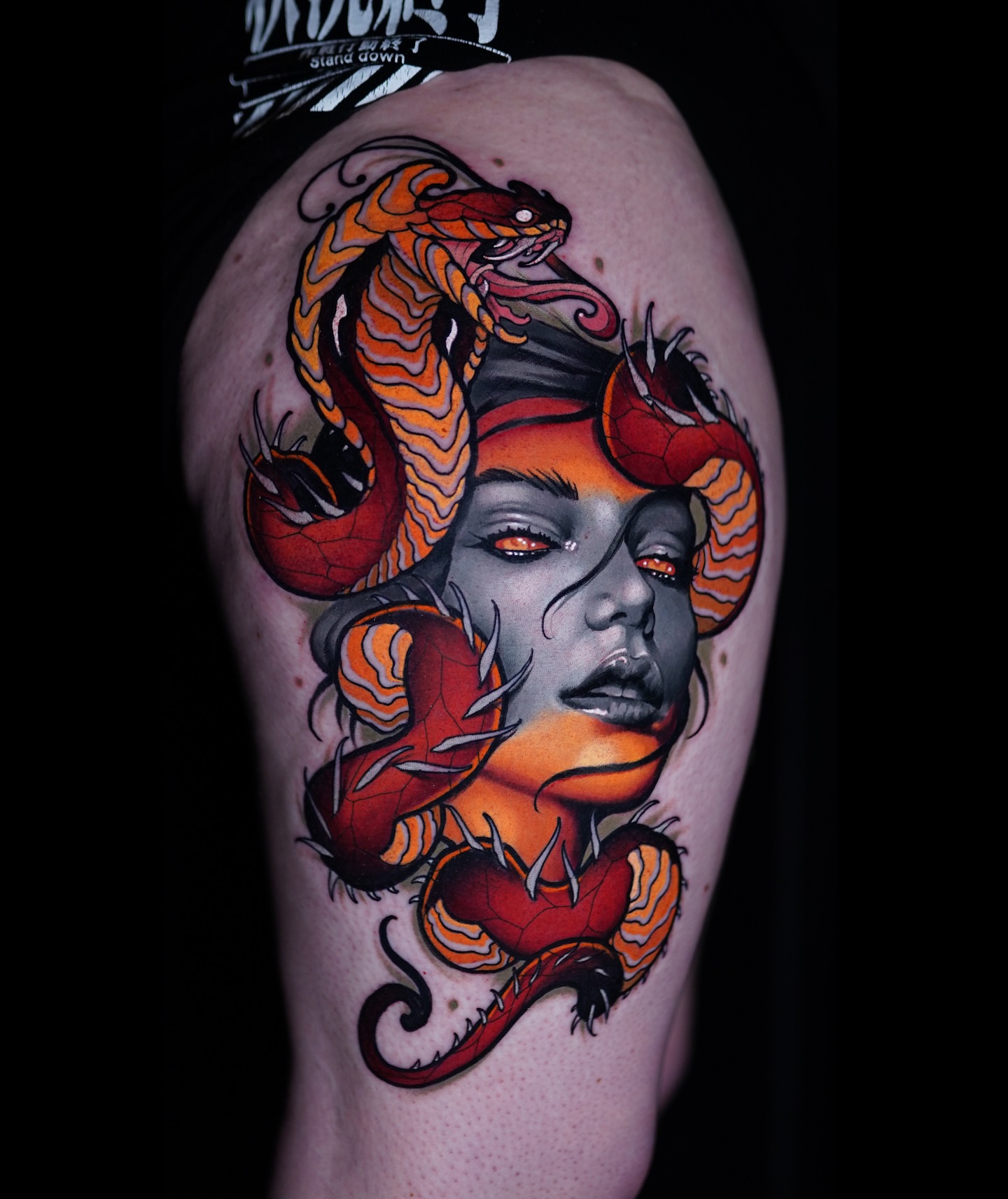 Woman with snakes new school tattoo on the shoulder by Andrey