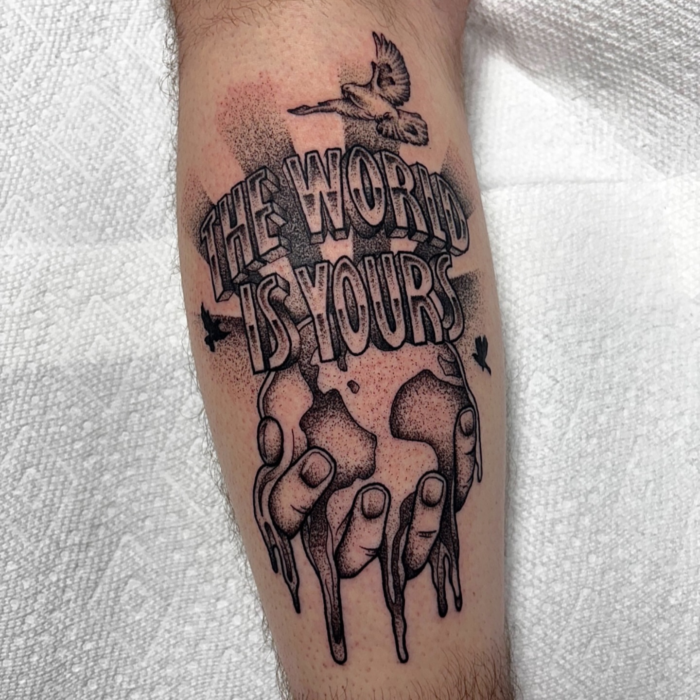 The world is yours dotwork tattoo on the forearm by Dyllan Shipley