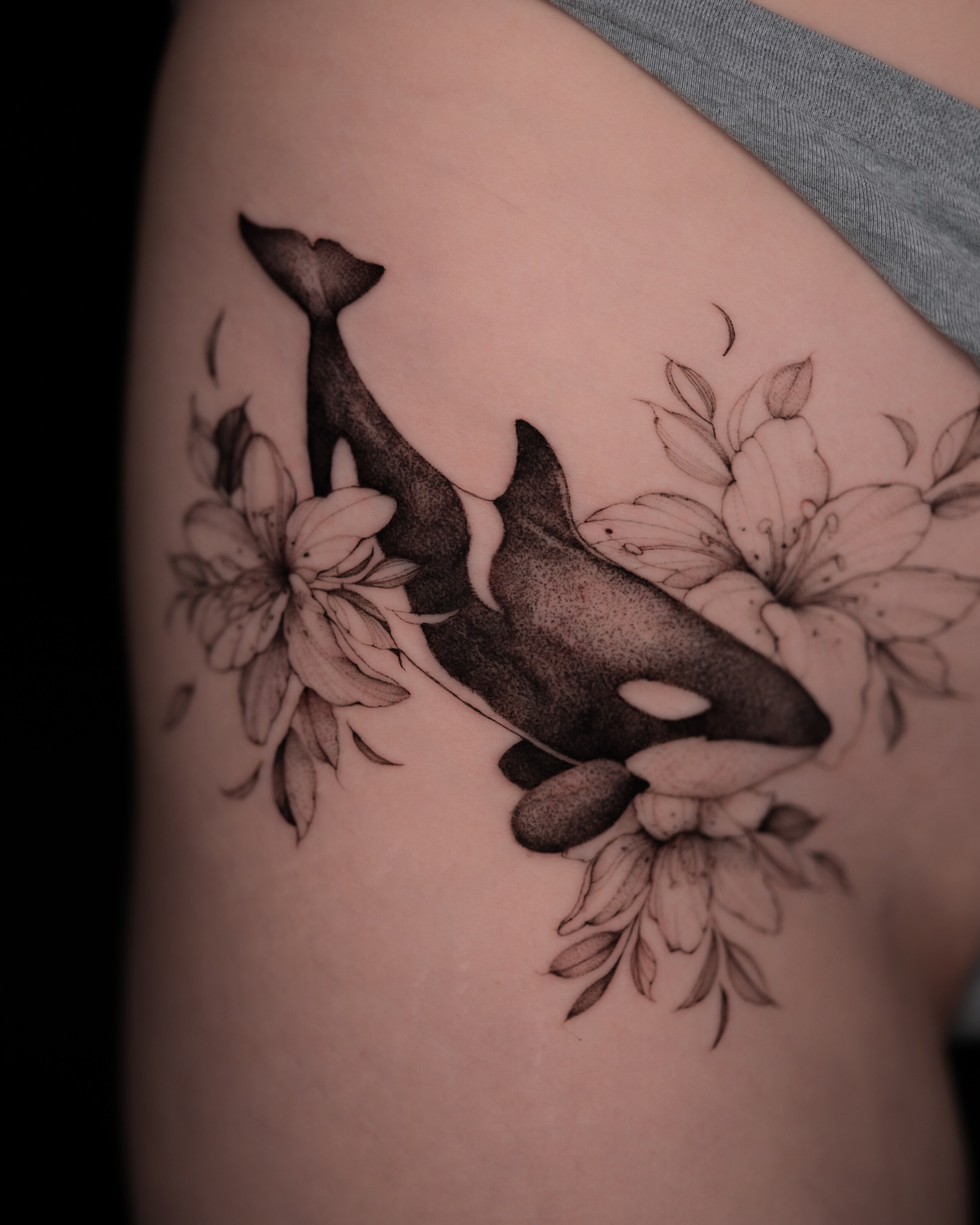 Whale and flowers dotwork tattoo on the thigh by Tattoo artist in Boston