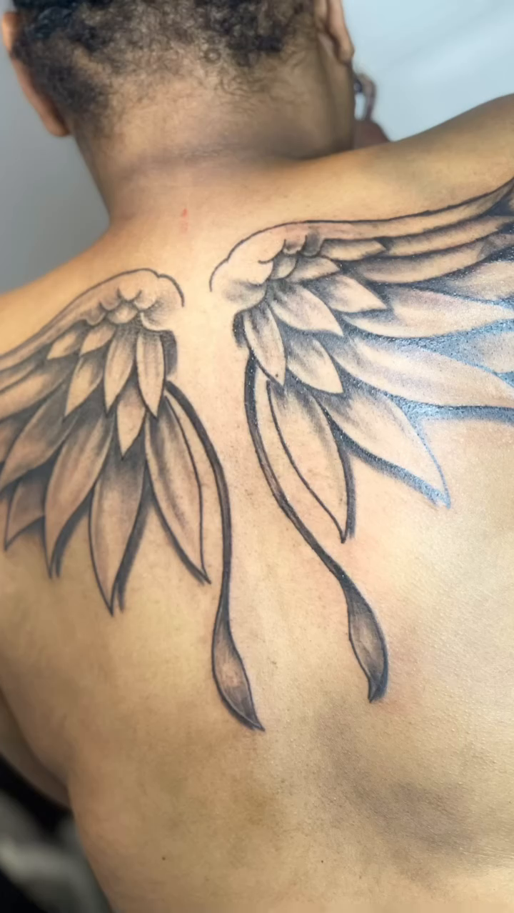 Angel wings realism tattoo on the back by Azaan (Zanye), Birmingham, Alabama