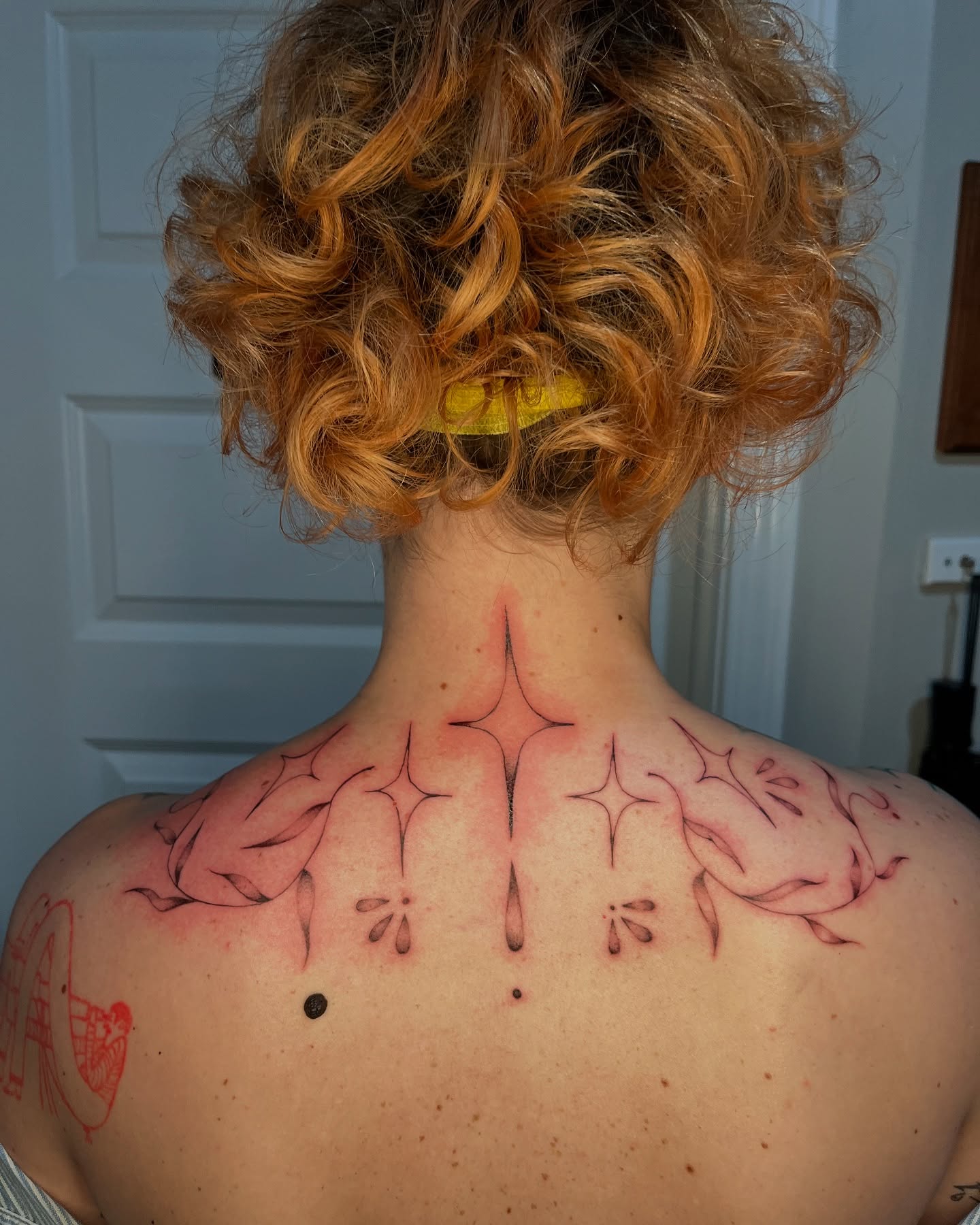 Abstract design geometric tattoo on the back by layne
