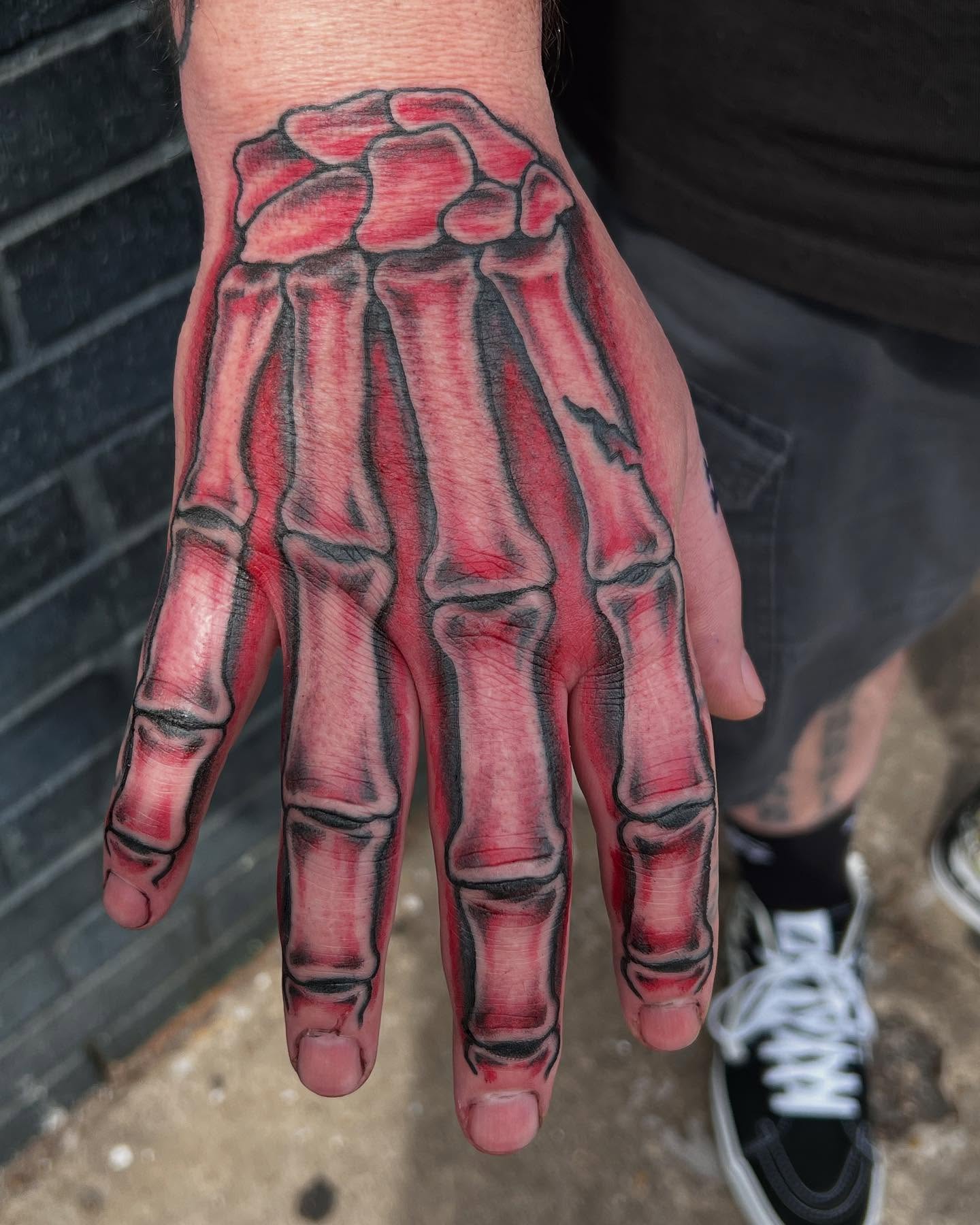 Skeleton hand realism tattoo on the hand by Scott Allen