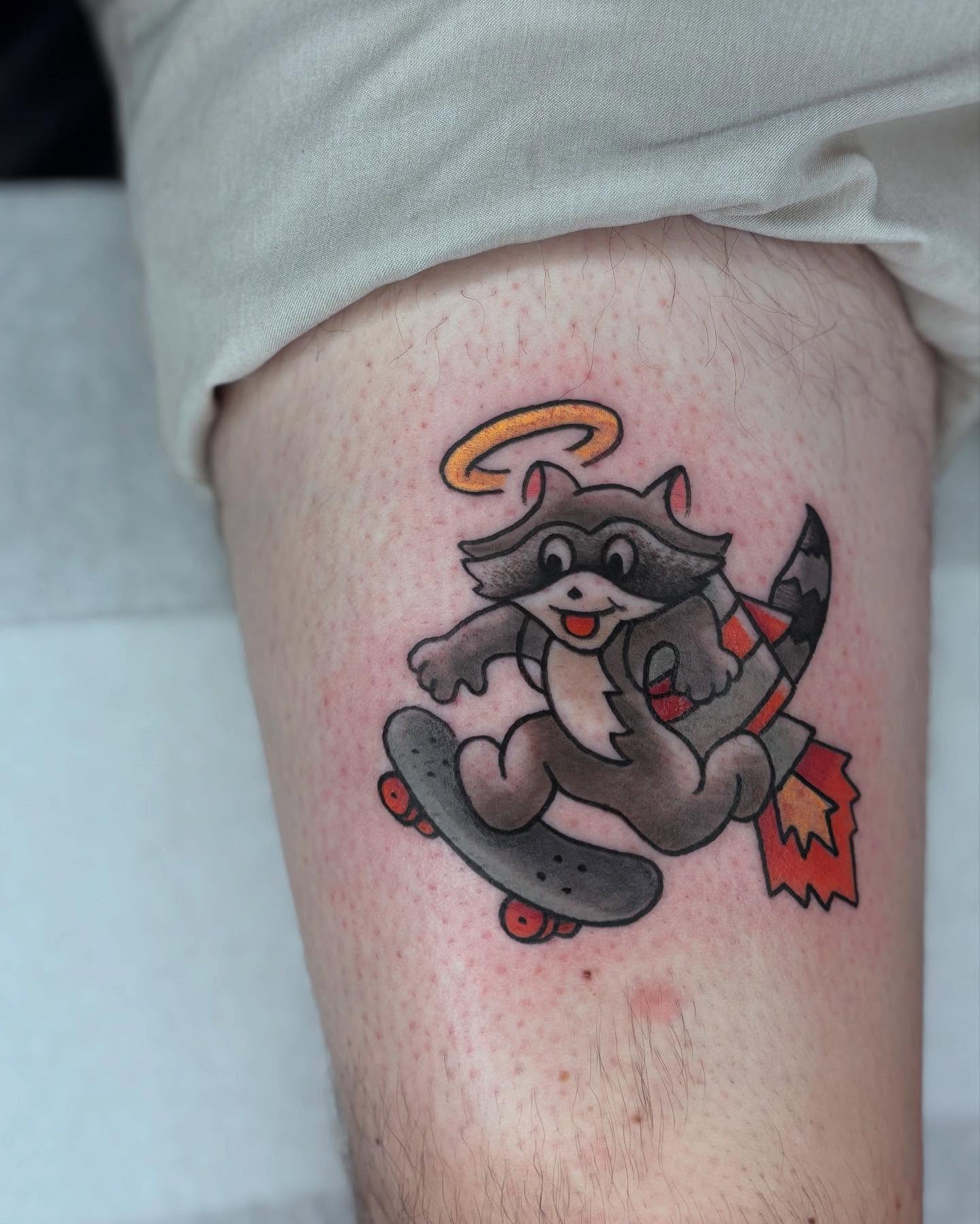 Raccoon on skateboard American traditional tattoo on the thigh by π»πΈπ½π½, Ypsilanti, Michigan