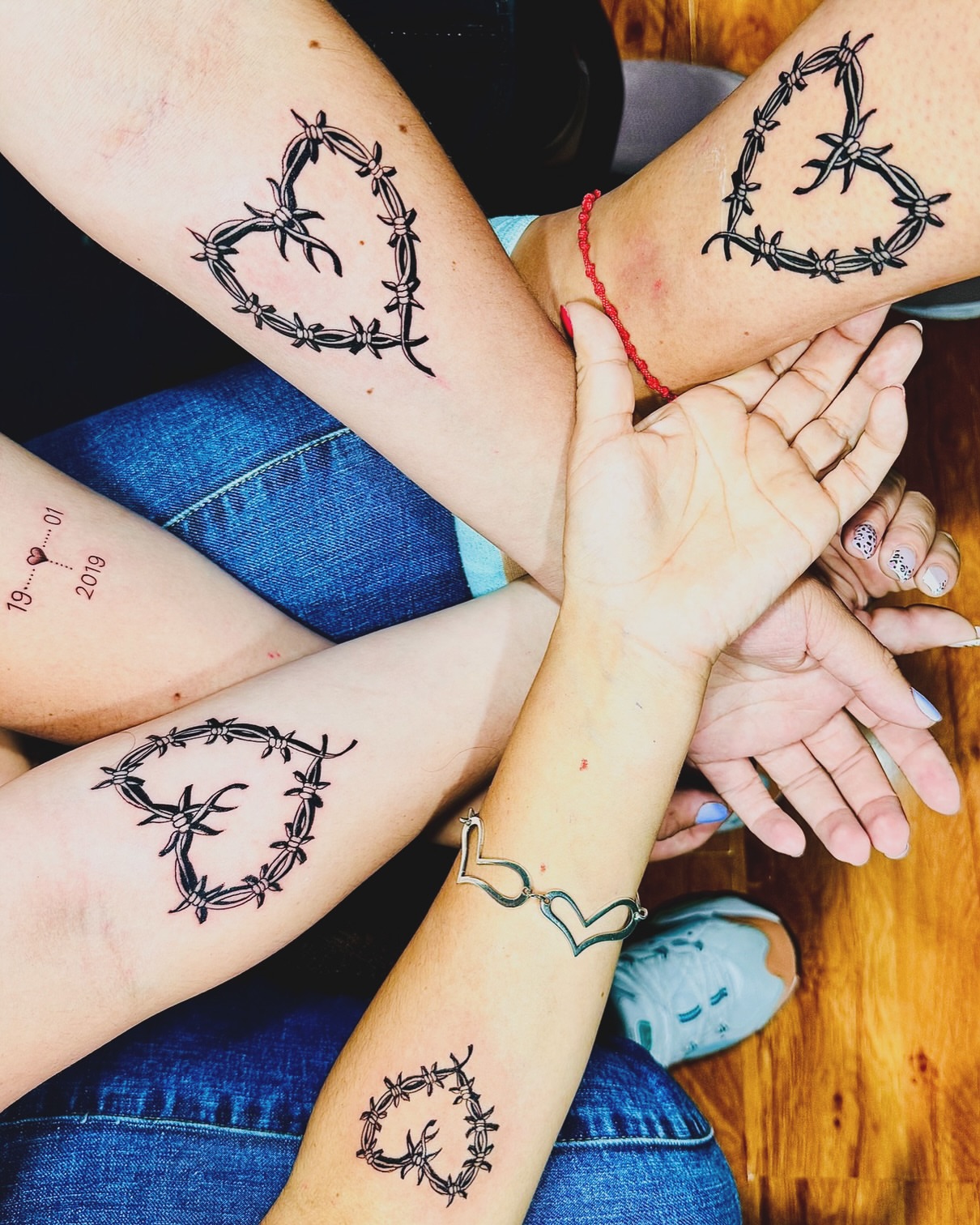 Barbed wire heart black and grey tattoo on the forearm by Alvaro